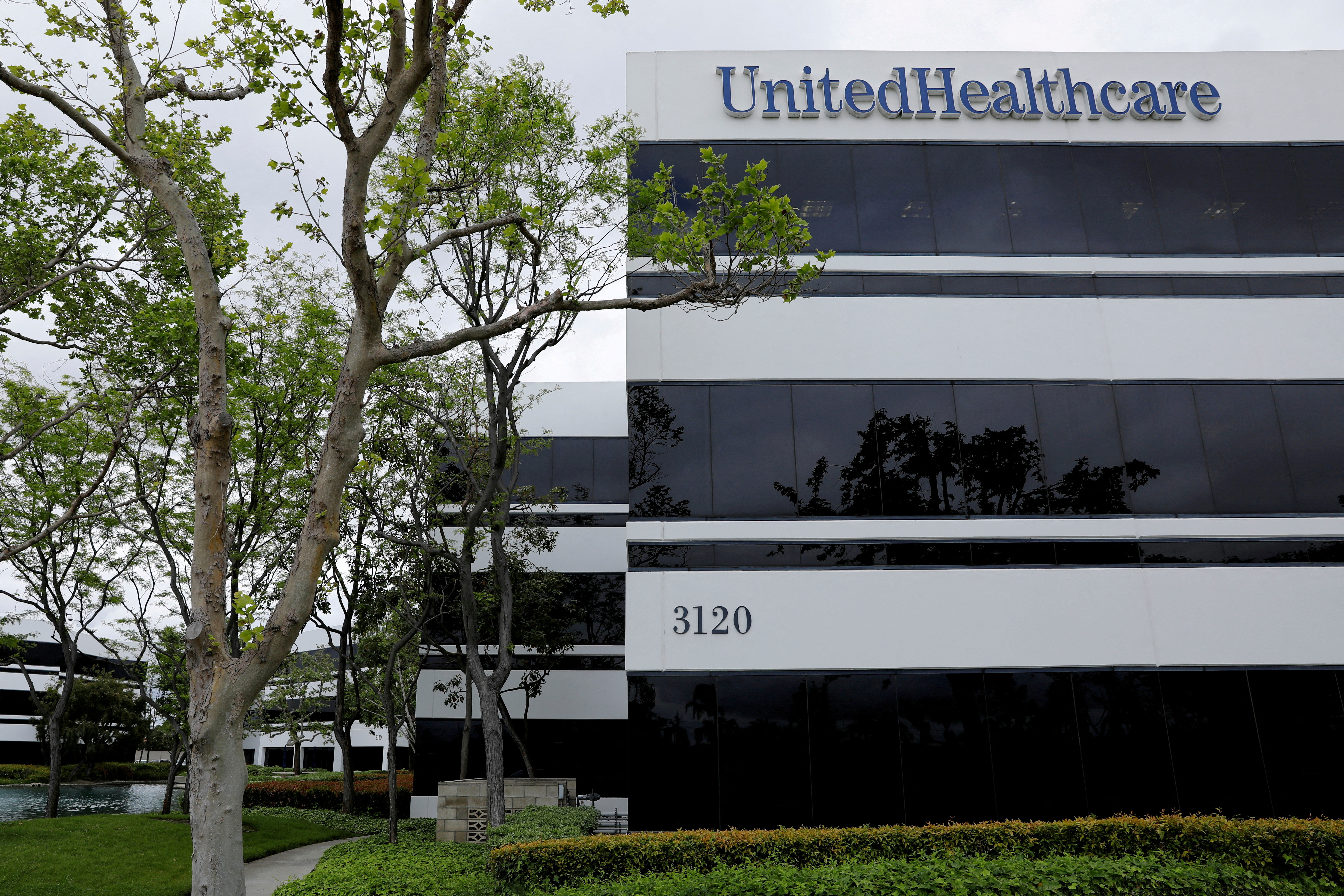 The corporate logo of the UnitedHealth Group appears on the side of one of their office buildings in Santa Ana, California