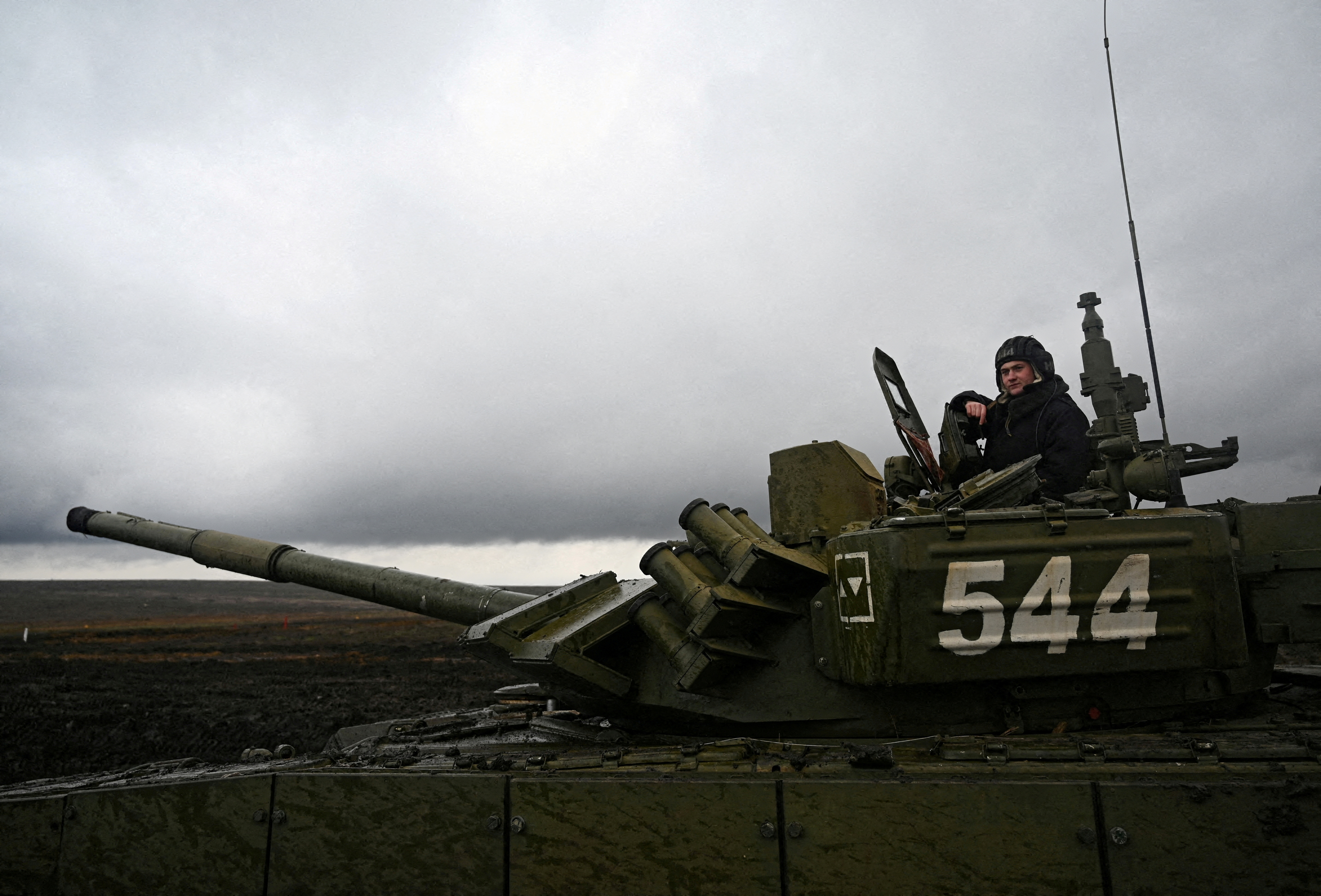A Russian service member is seen atop a T-72B3 main battle tank during military drills at the Kadamovsky range in the Rostov region, Russia December 20, 2021