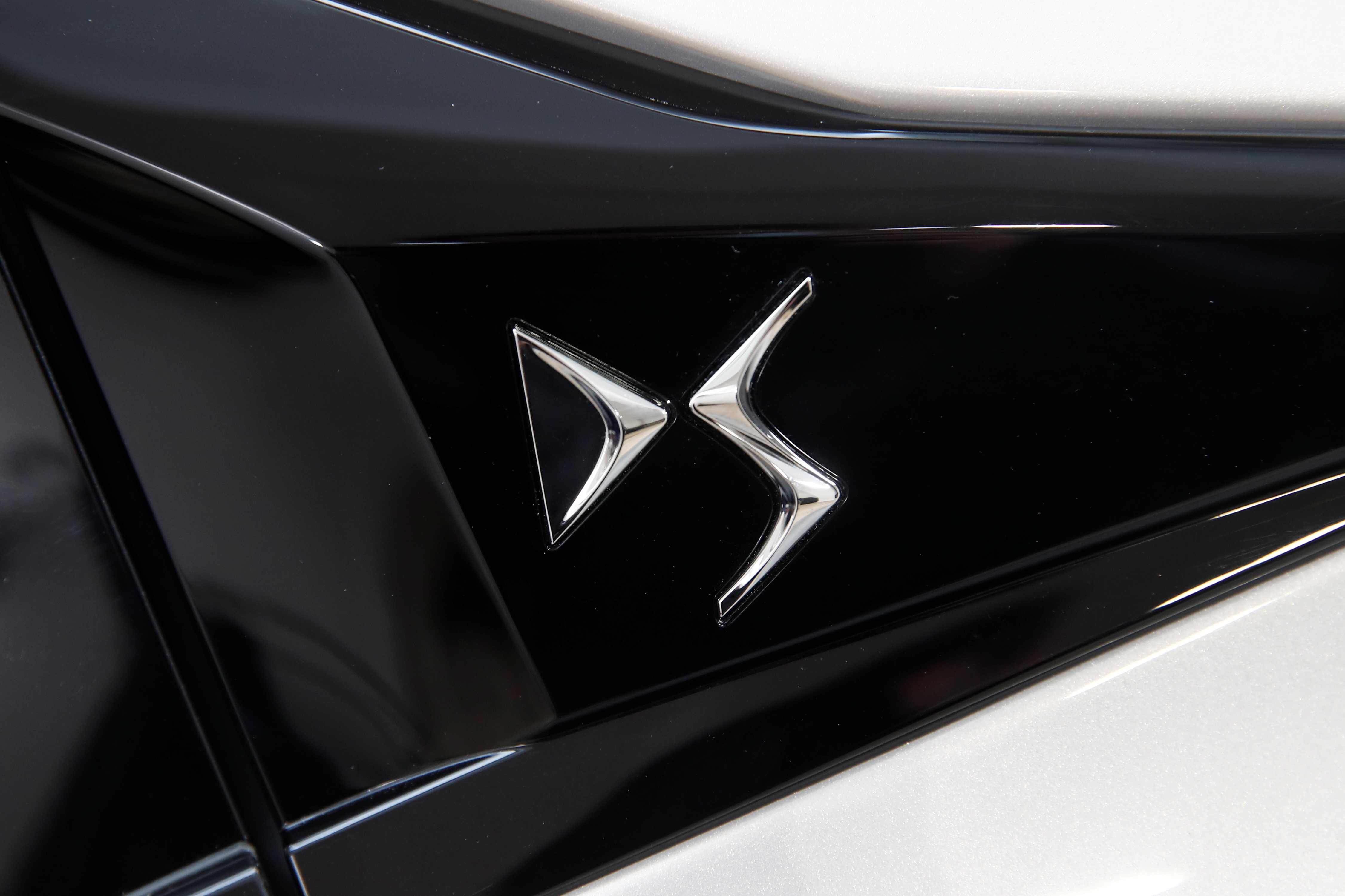 The logo of DS is seen on a DS 4 automobile, produced by Stellantis, during its launch event in Paris