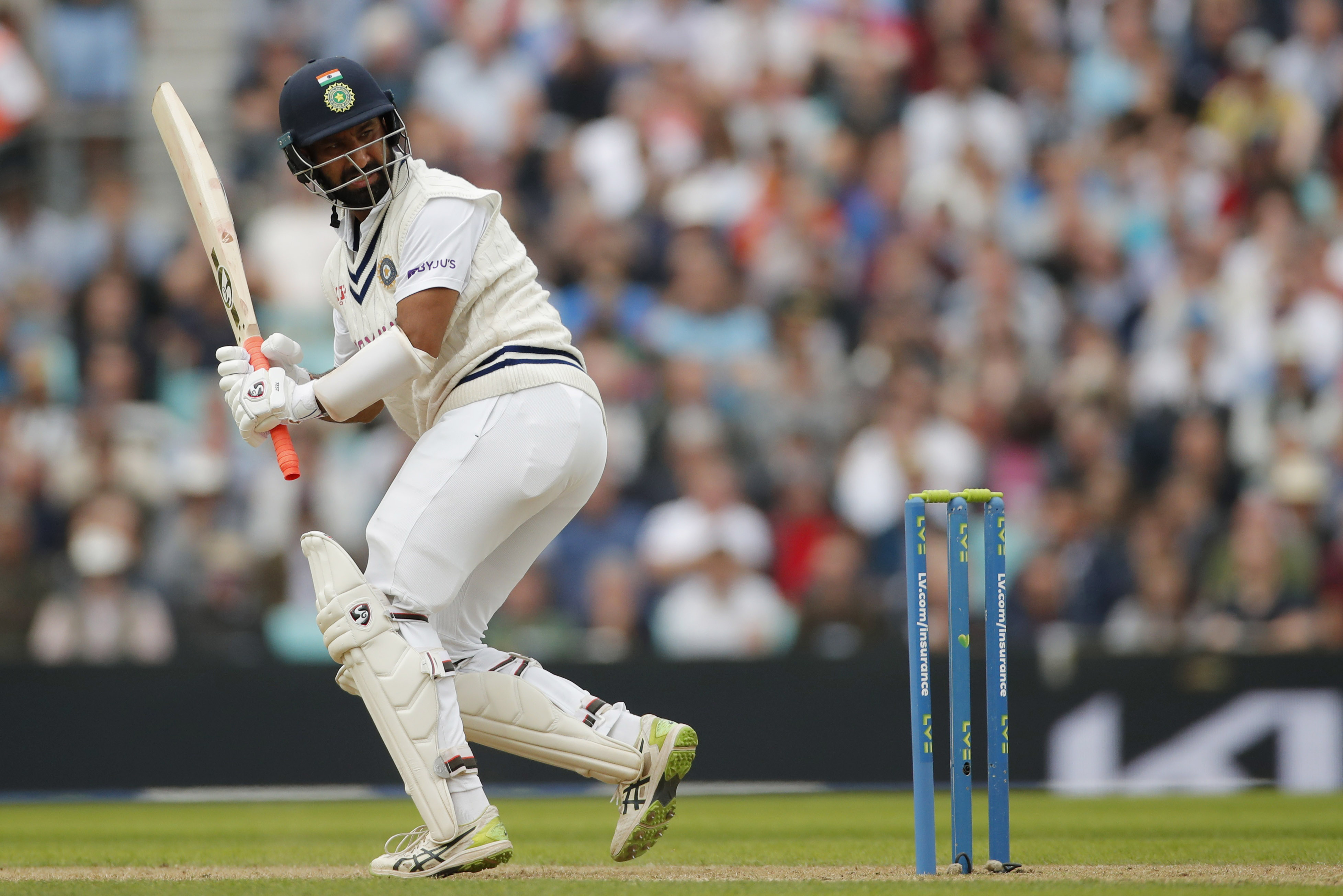 Slow but steady, India's Pujara constructs another test hundred | Reuters