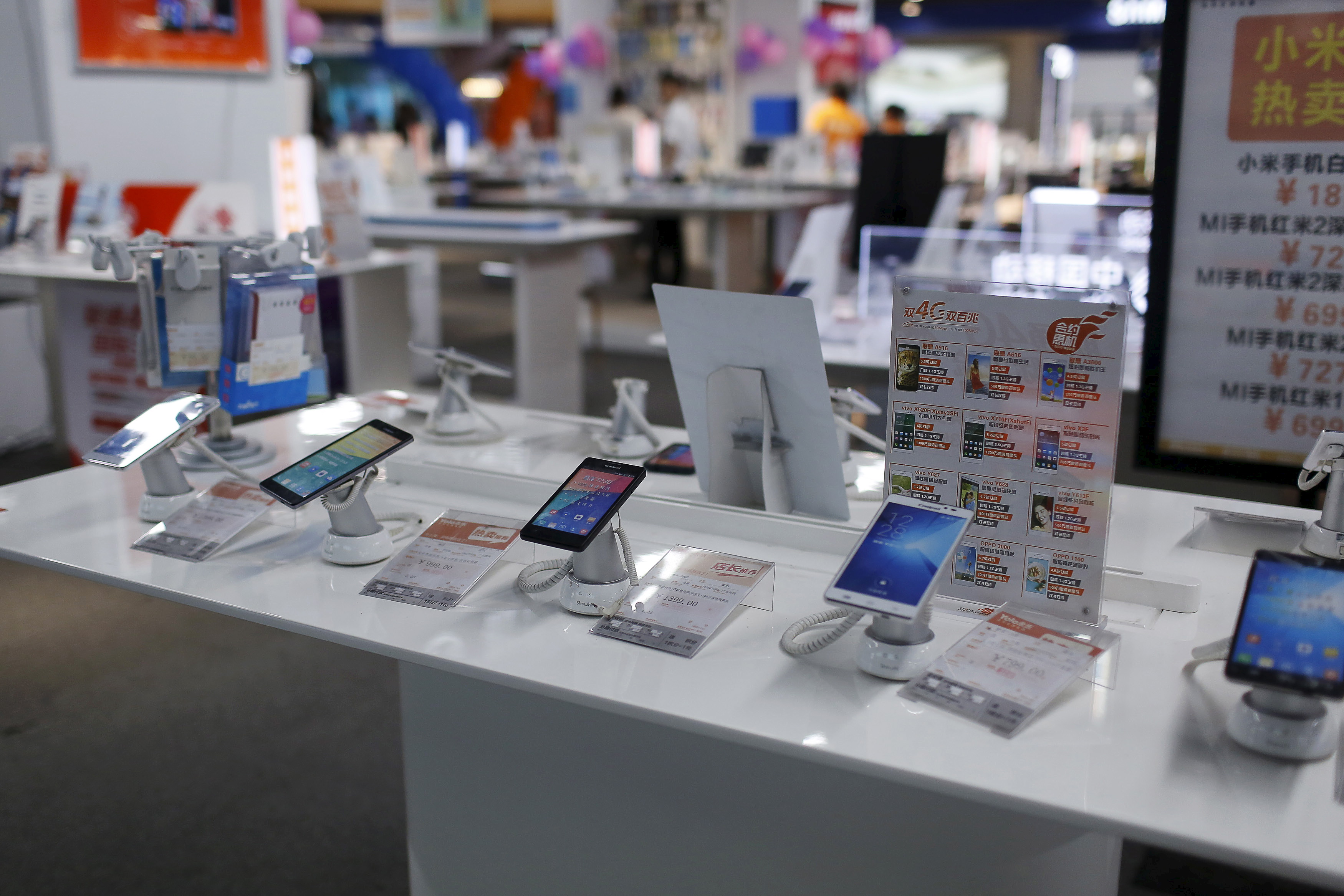Mobile phones are seen on display at an electronics market in Shanghai