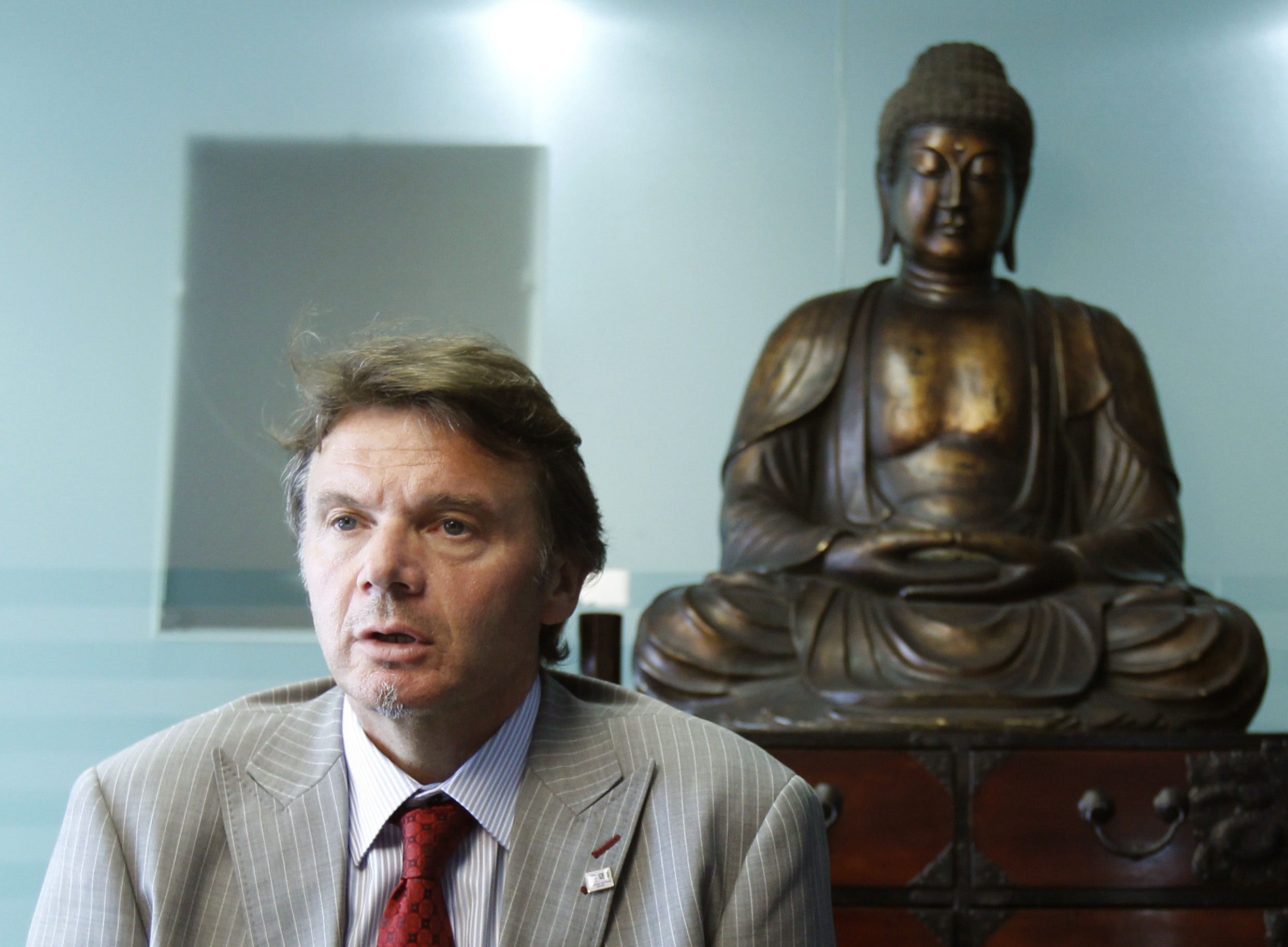 'We have to dream', Troussier backs World Cup expansion | Reuters