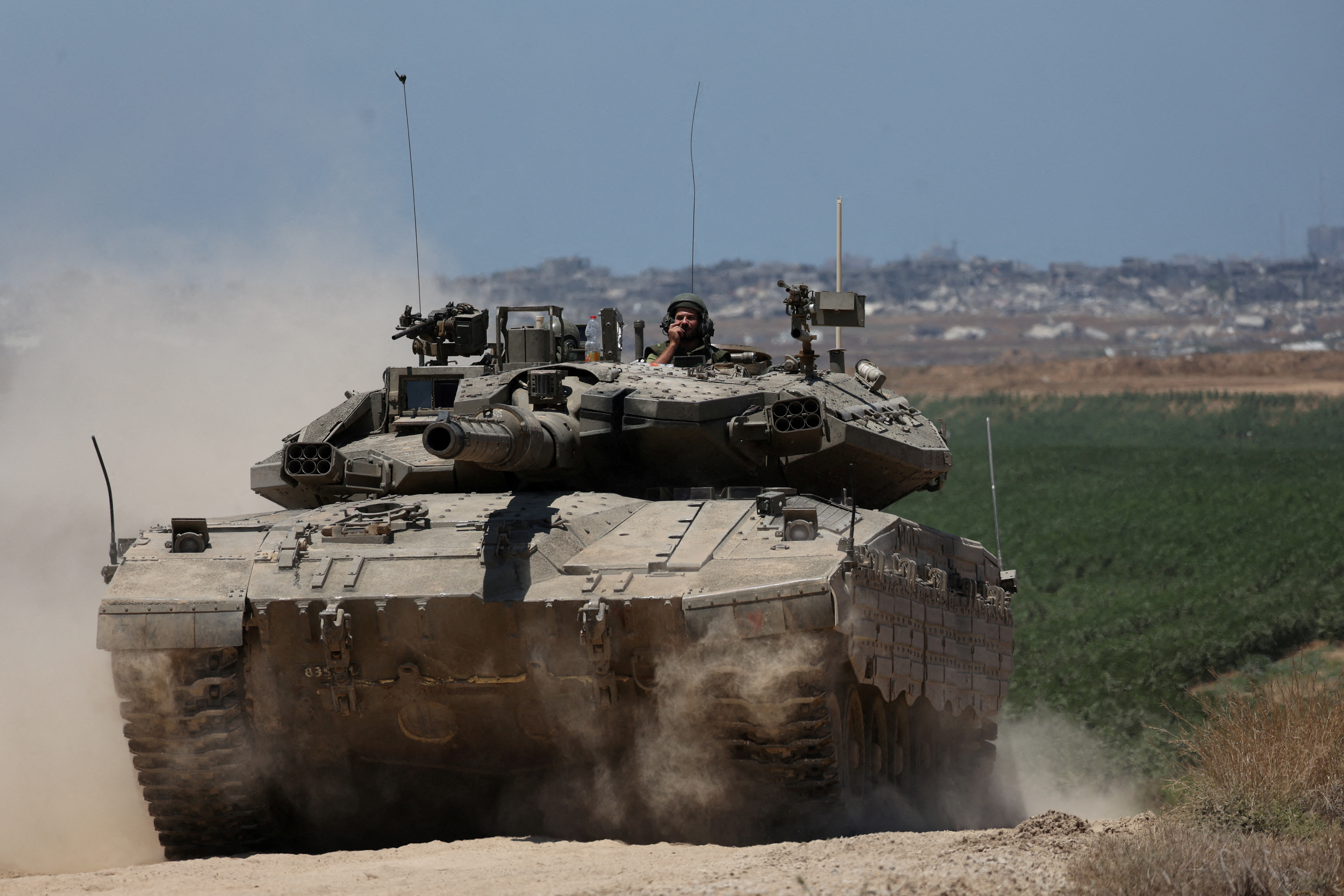 An Israeli tank manoeuvres near the Israel-Gaza border