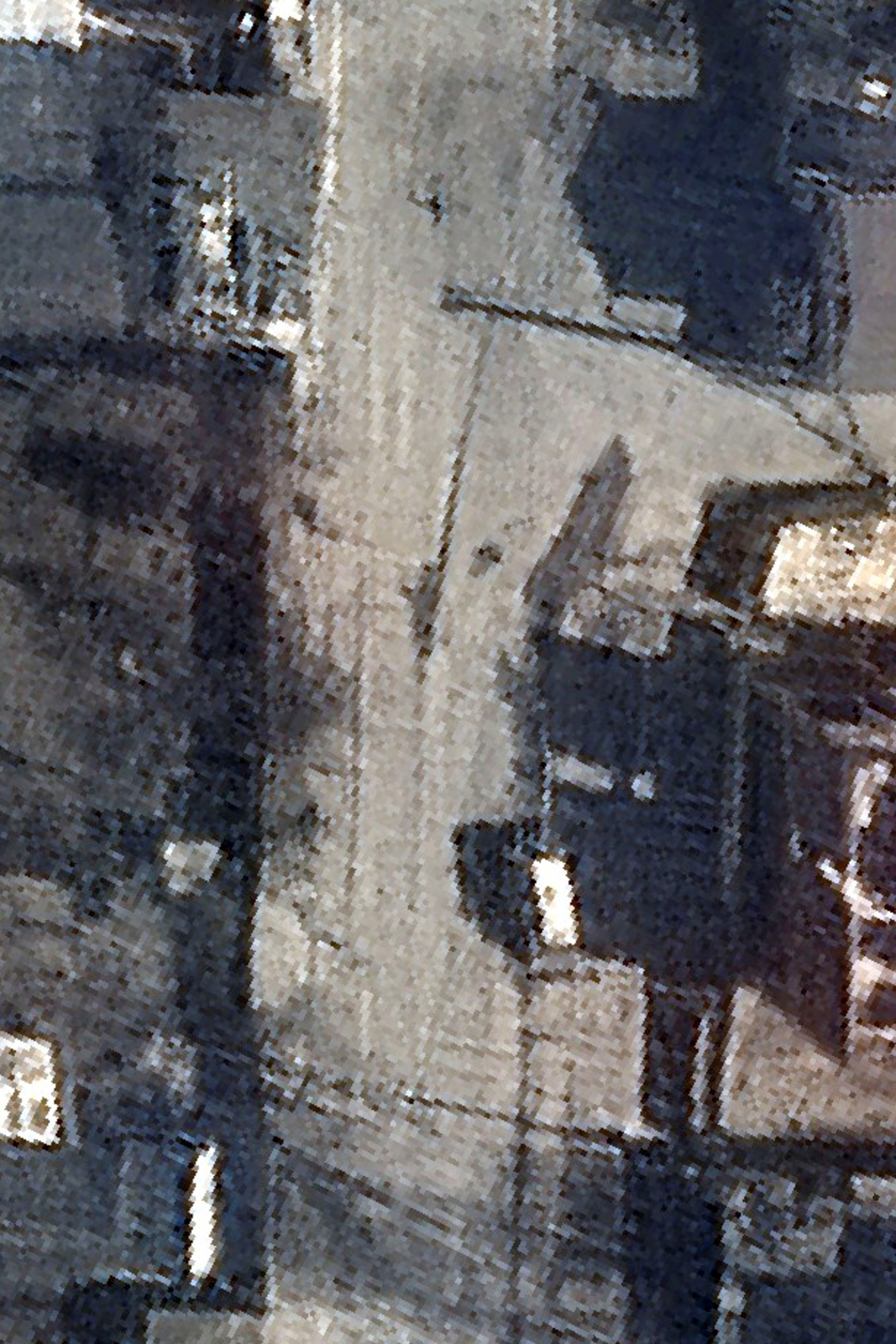 A satellite image shows dead bodies on Yablonska Street in Bucha