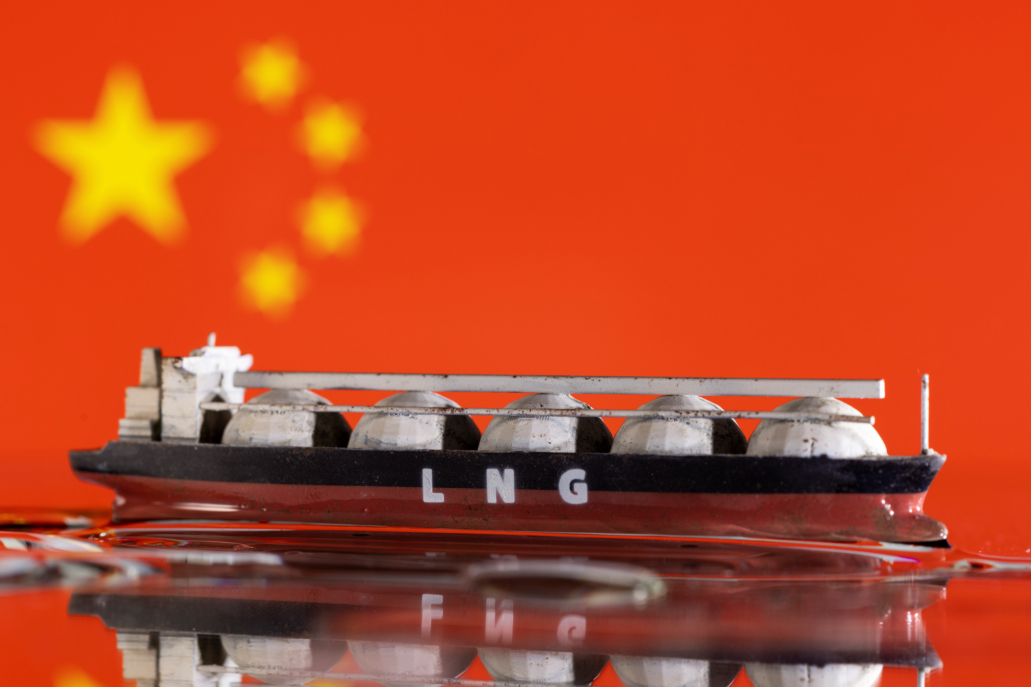 Illustration shows model of LNG tanker and China's flag