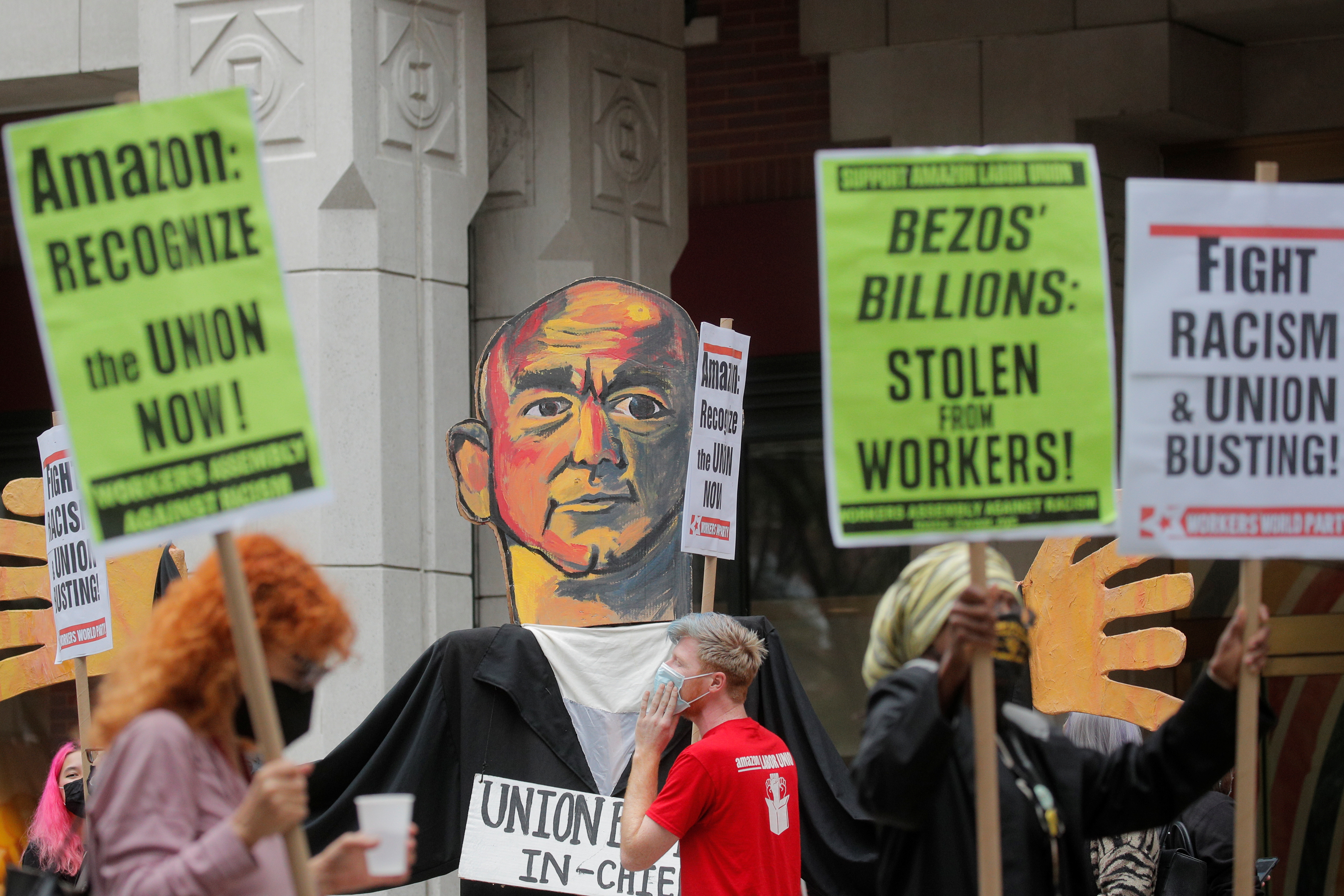 Amazon workers protest outside the NLRB office as workers arrive to unionize, in Brooklyn, New York