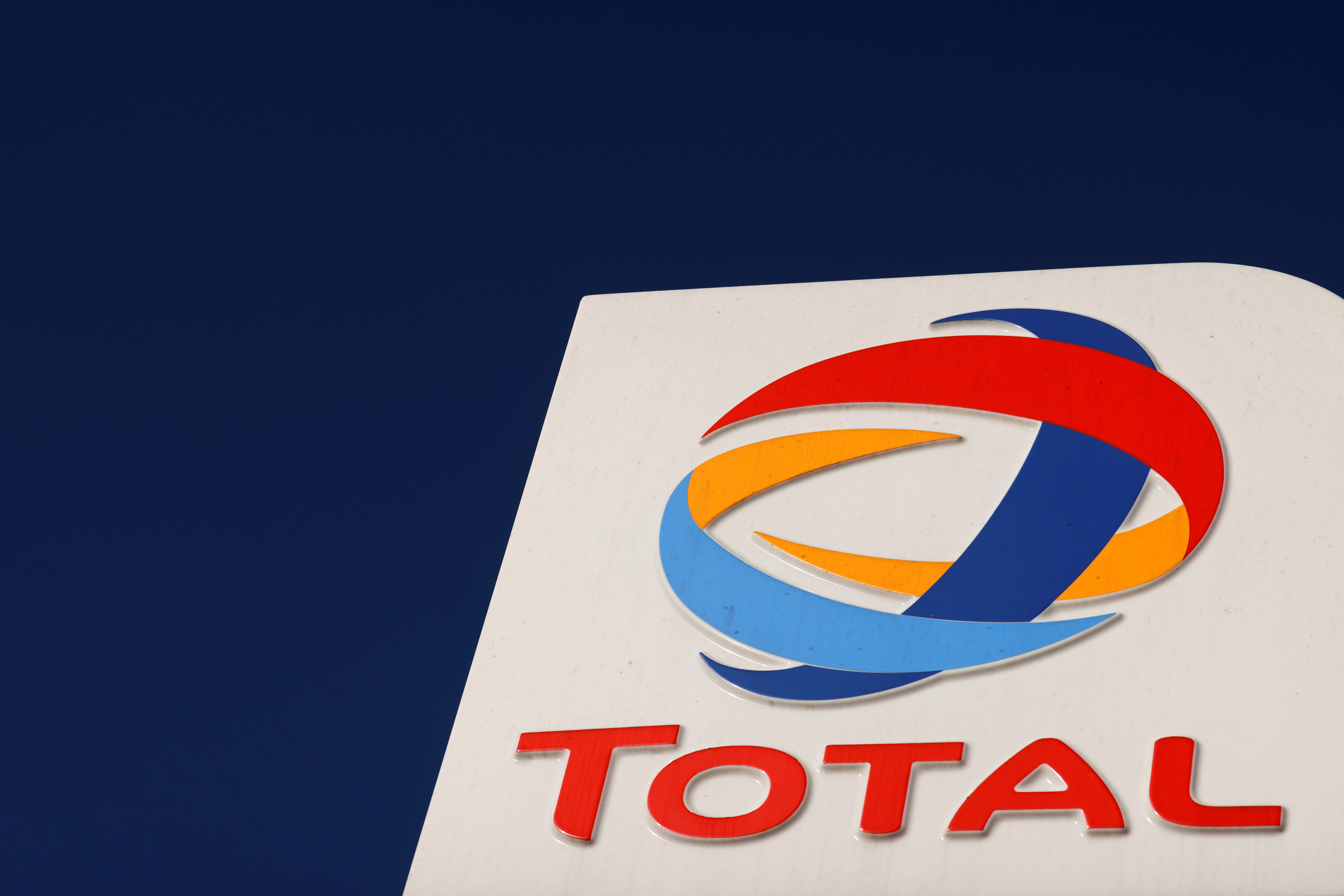 The logo of French oil and gas company Total is seen at a petrol station in Neuville Saint Remy, France, October 1, 2020. REUTERS/Pascal Rossignol/File Photo