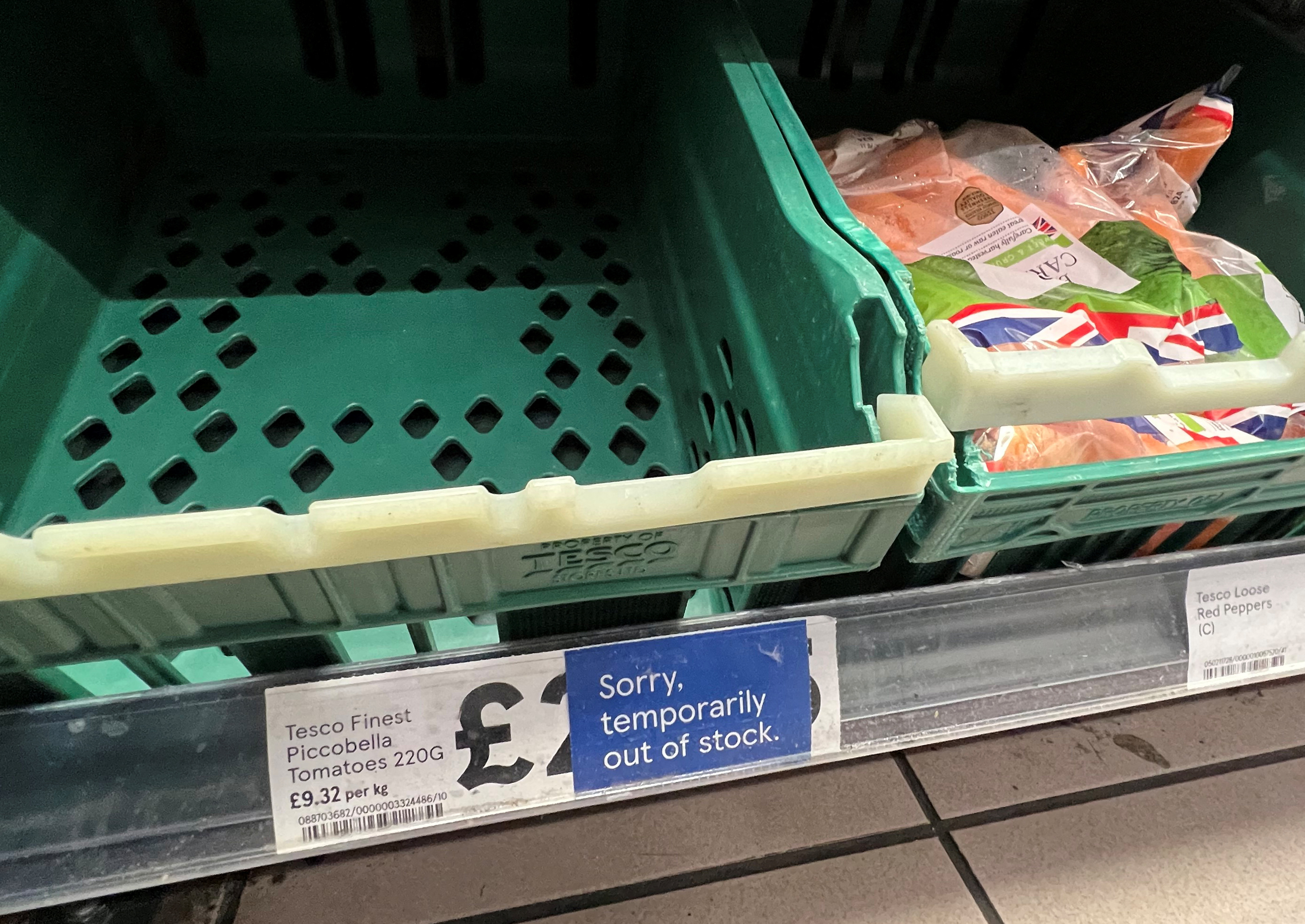 Empty tomato section is seen on shelves at Tesco supermarket in London