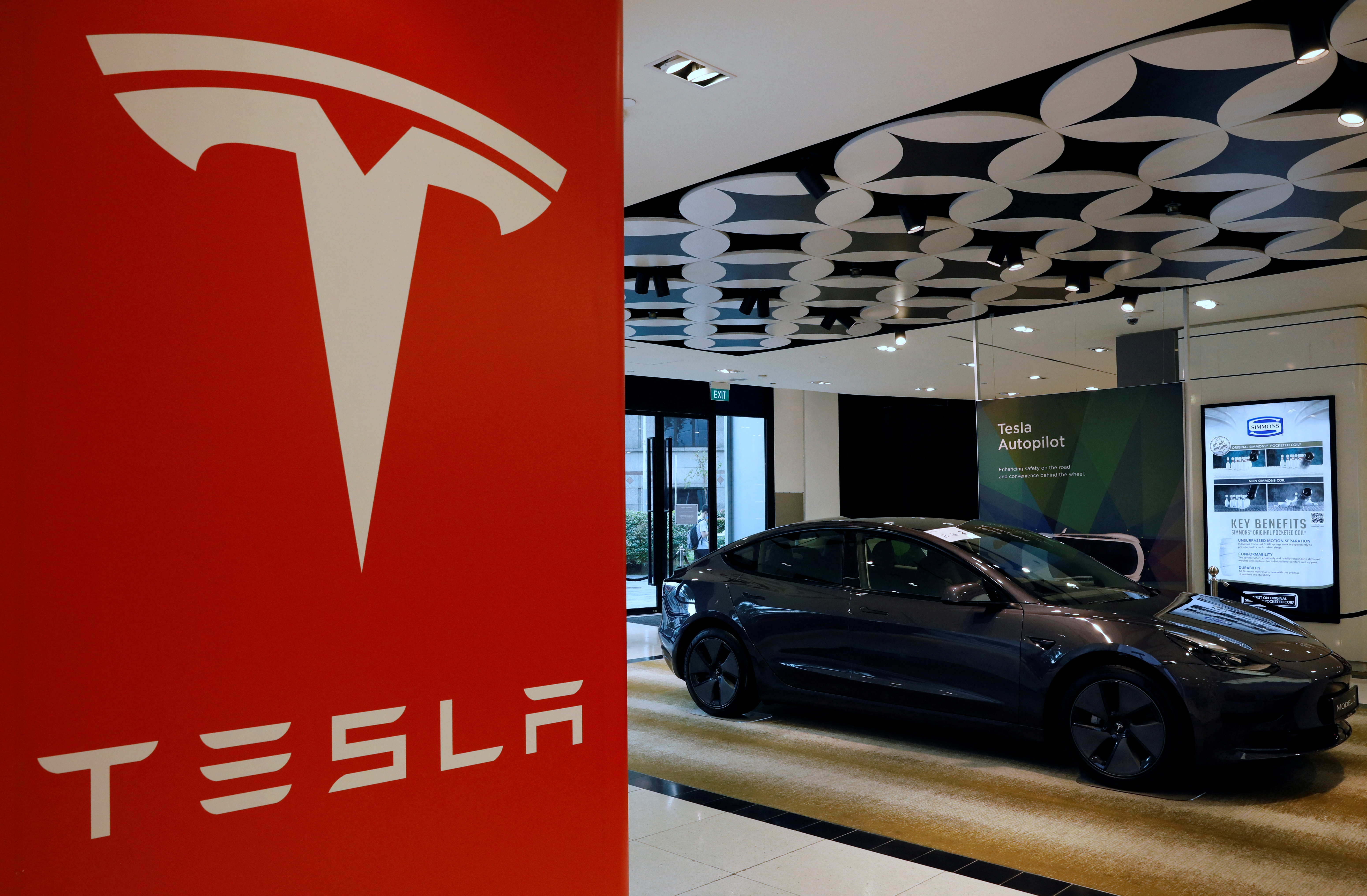 A Tesla model 3 car is seen in their showroom in Singapore October 22, 2021. Picture taken October 22, 2021. REUTERS/Edgar Su