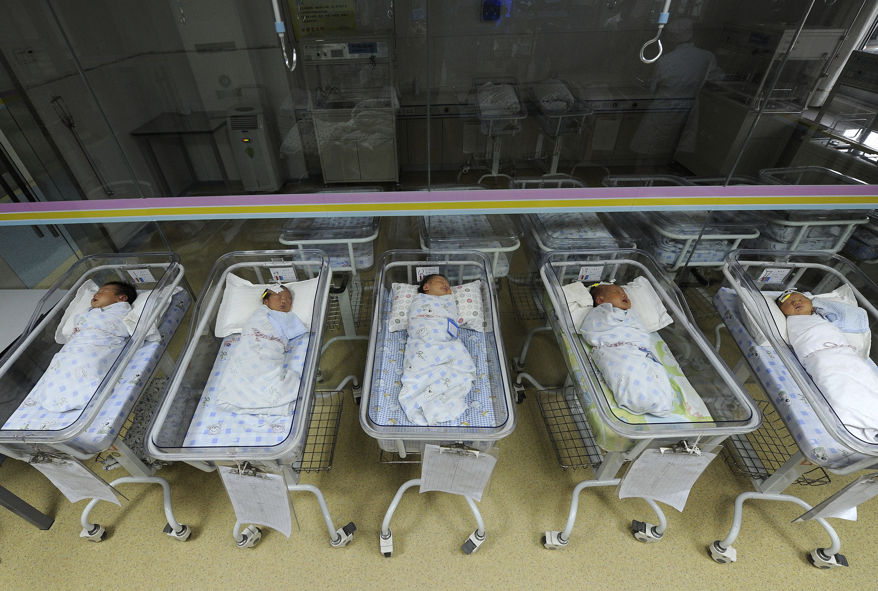 Newborn babies sleep in a ward at a hospital in Hefei