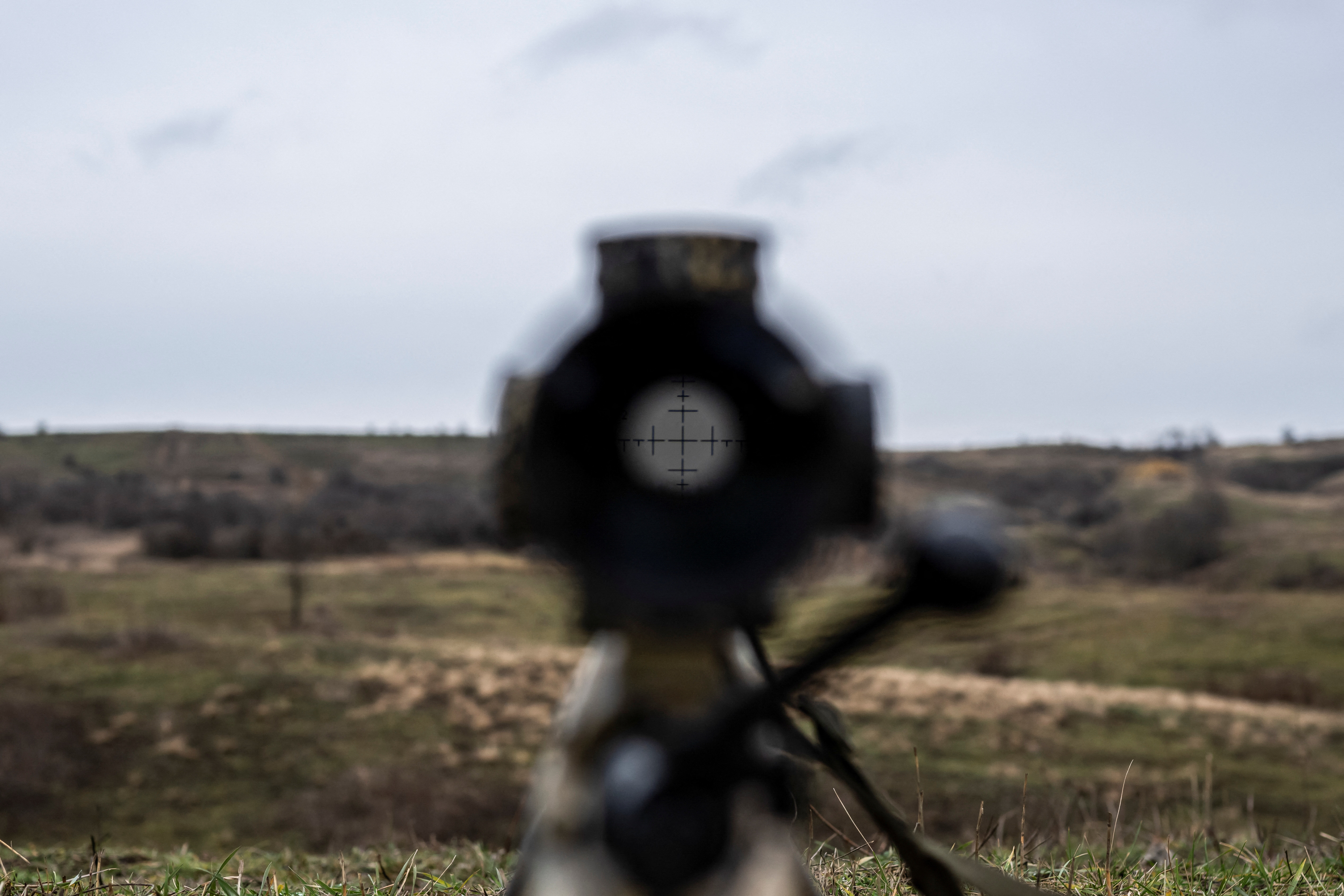 View shows an optical sight on a rifle of a Ukrainian Army sniper at a shooting ground near a front line in Donetsk region