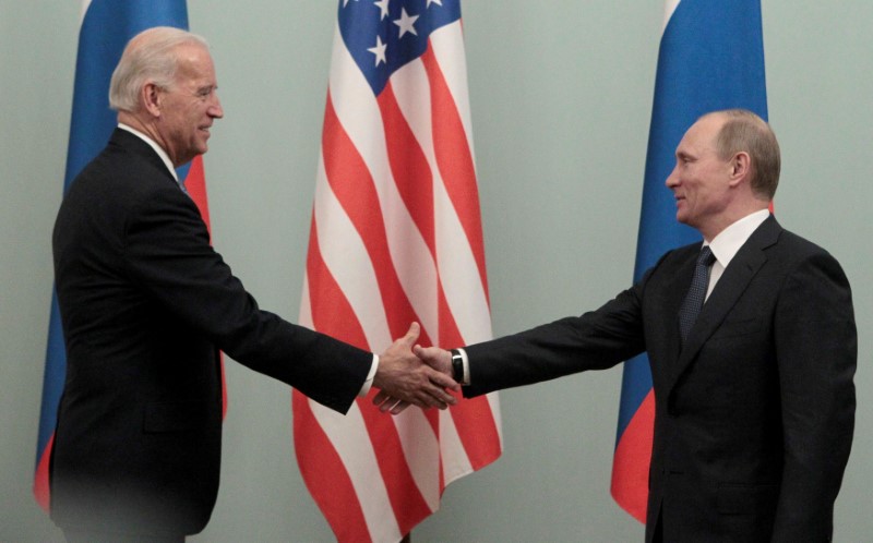 Russian Prime minister Putin shakes hands with U.S. Vice President Biden during their meeting in Moscow