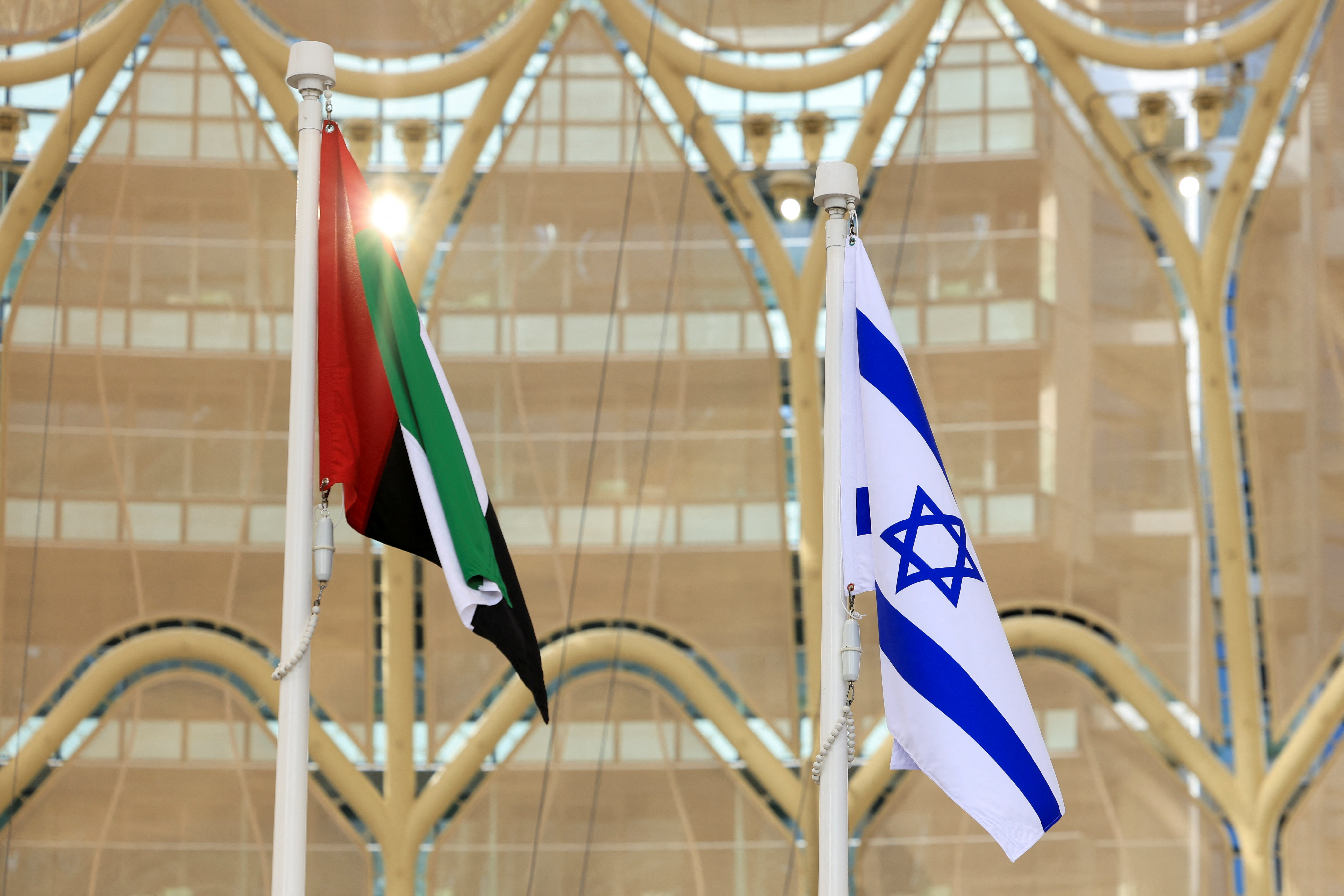 Flags of United Arab Emirates and Israel flutter during Israel's National Day ceremony at Expo 2020 Dubai, in Dubai