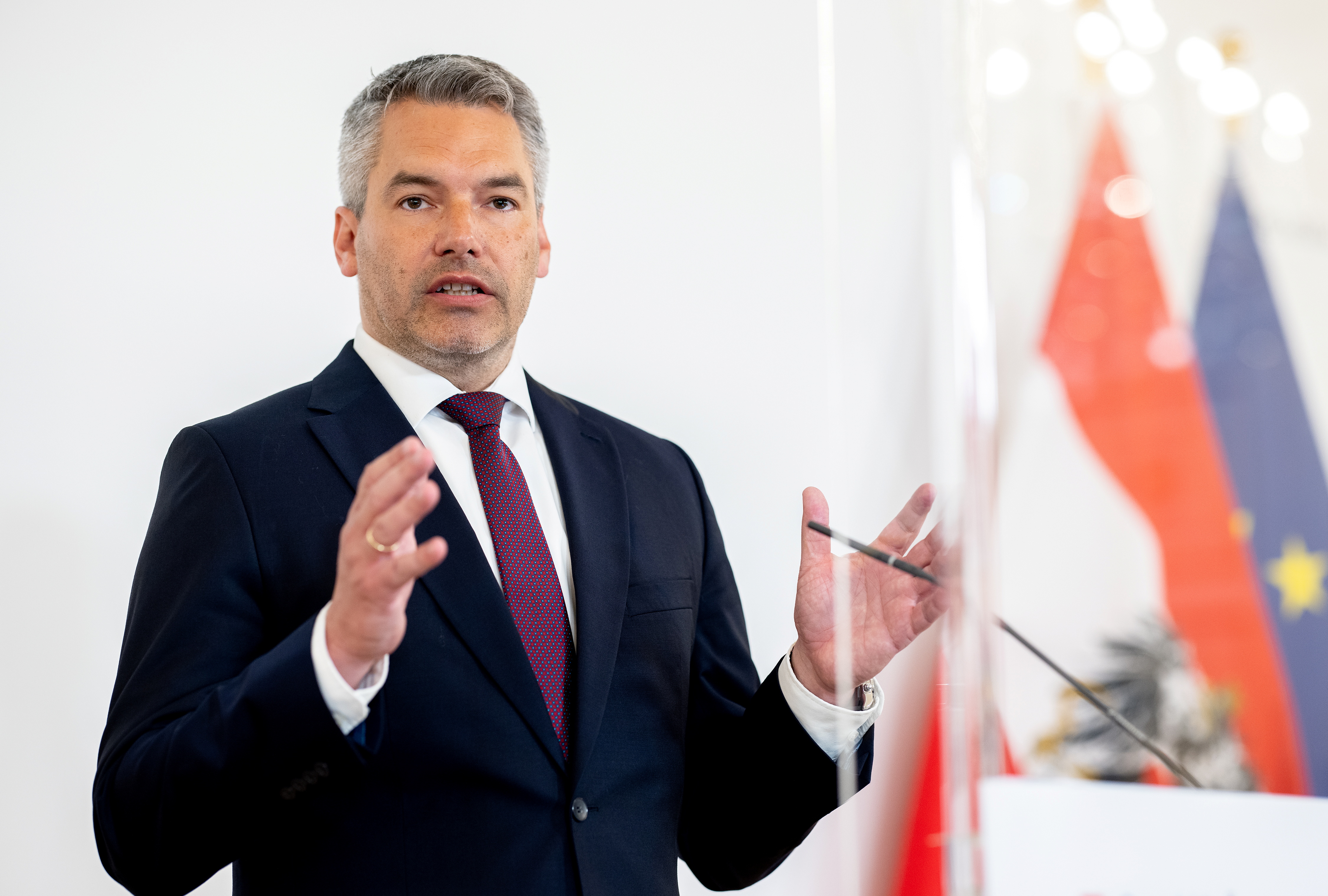 Austrian Interior Minister Karl Nehammer speaks at a news conference on Austria's role in a global sting against organised crime dubbed 'Operation Trojan Shield' in Vienna, Austria June 9, 2021. REUTERS/Lisi Niesner