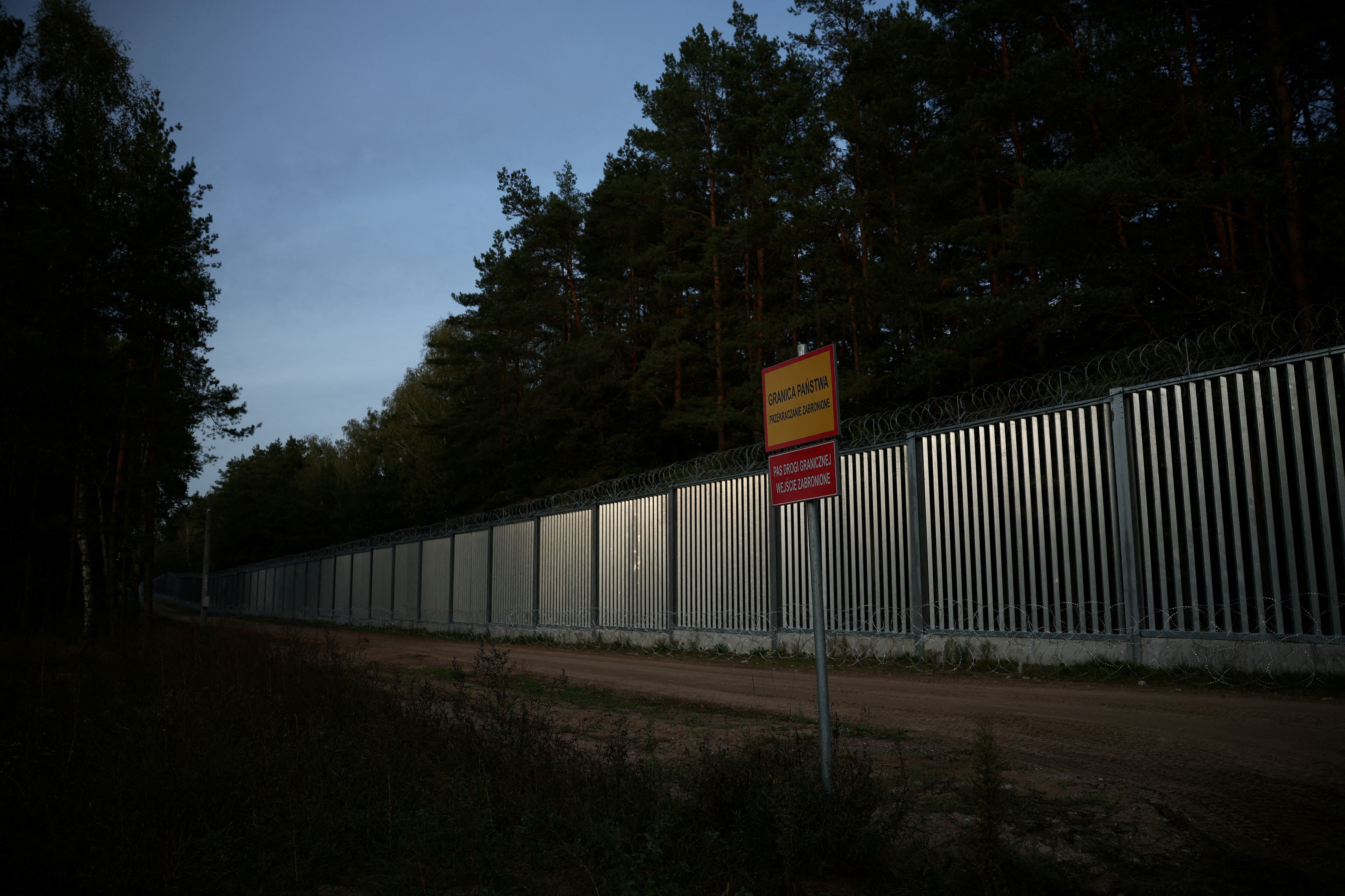 General view of the fence on the Polish-Belarusian border at sunset, during the migrant crisis, in Opaka Duza