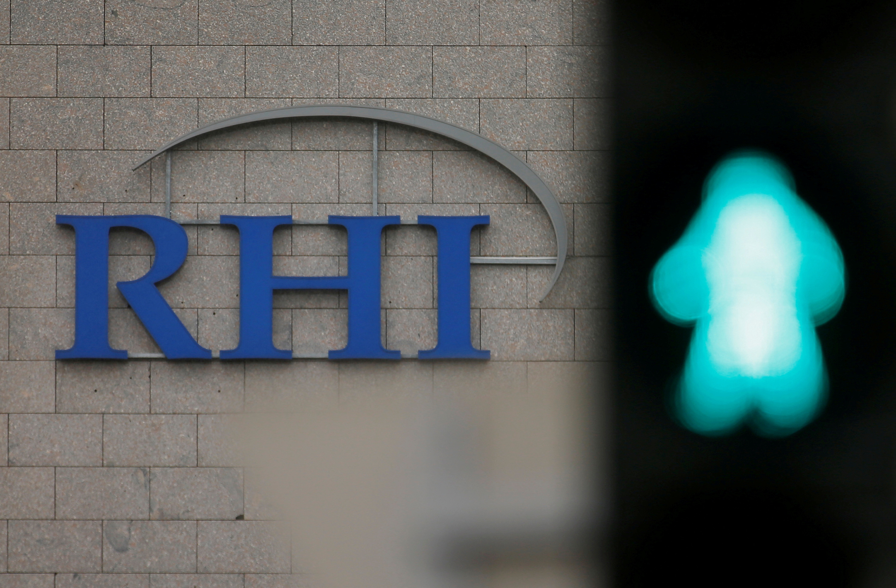 The logo of Austrian specialised fireproof materials maker RHI is pictured behind a traffic light at an office park building where its headquarters are located in Vienna