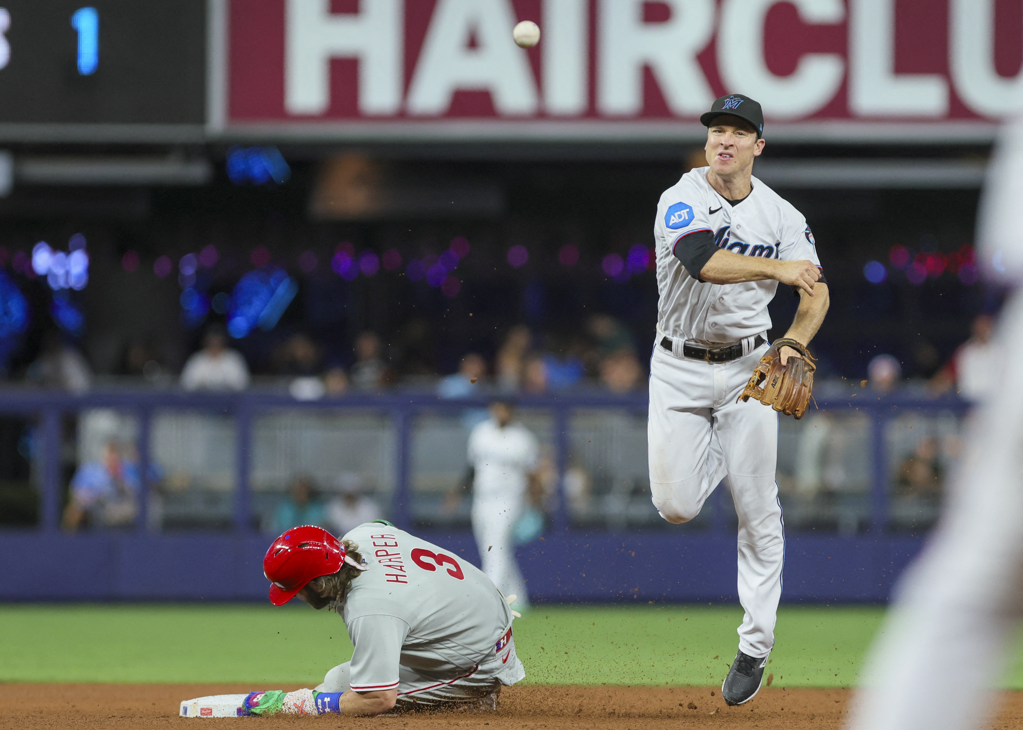 Marlins mount comeback behind two homers to stun Phillies