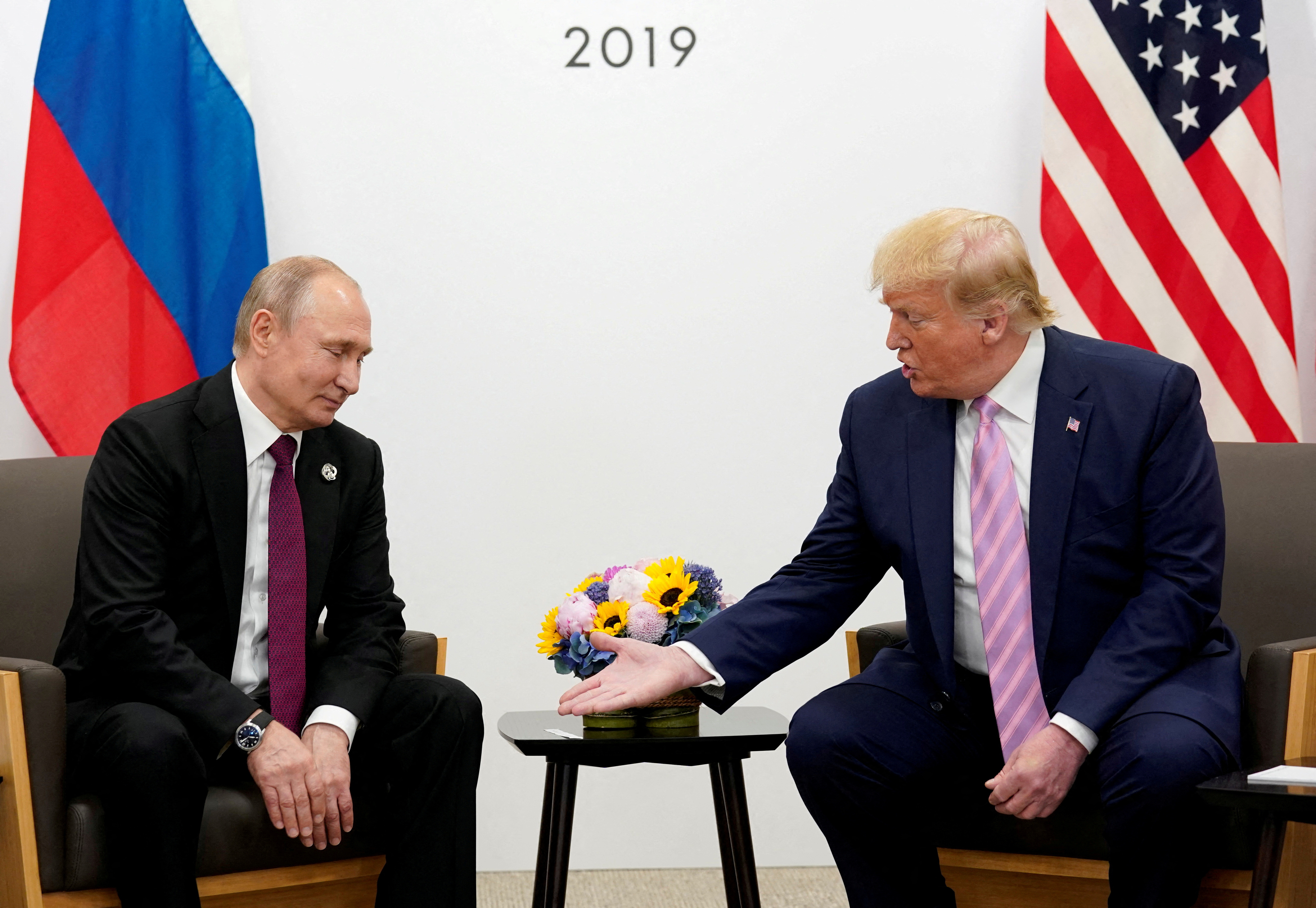 U.S. President Donald Trump gestures during a bilateral meeting with Russia's President Vladimir Putin at the G20 leaders summit in Osaka, Japan, June 28, 2019. REUTERS/Kevin Lamarque//File Photo