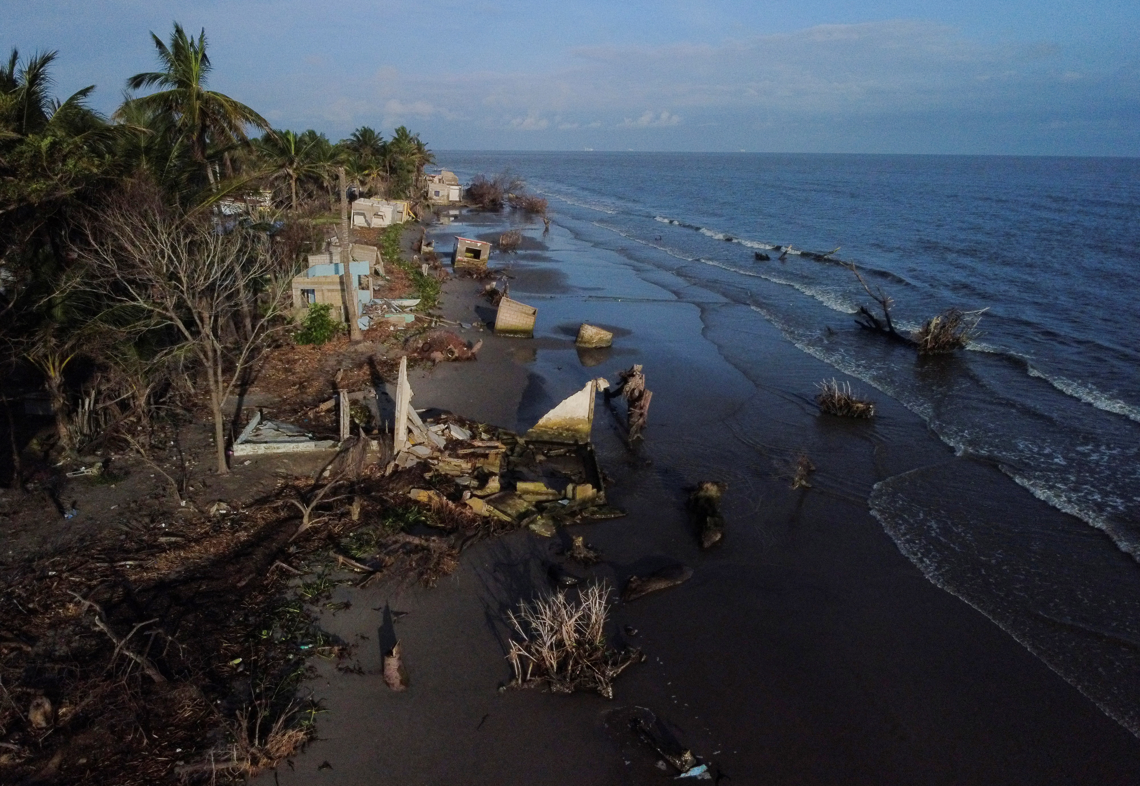 Mexican village blames climate change as sea swallows its homes, in El Bosque