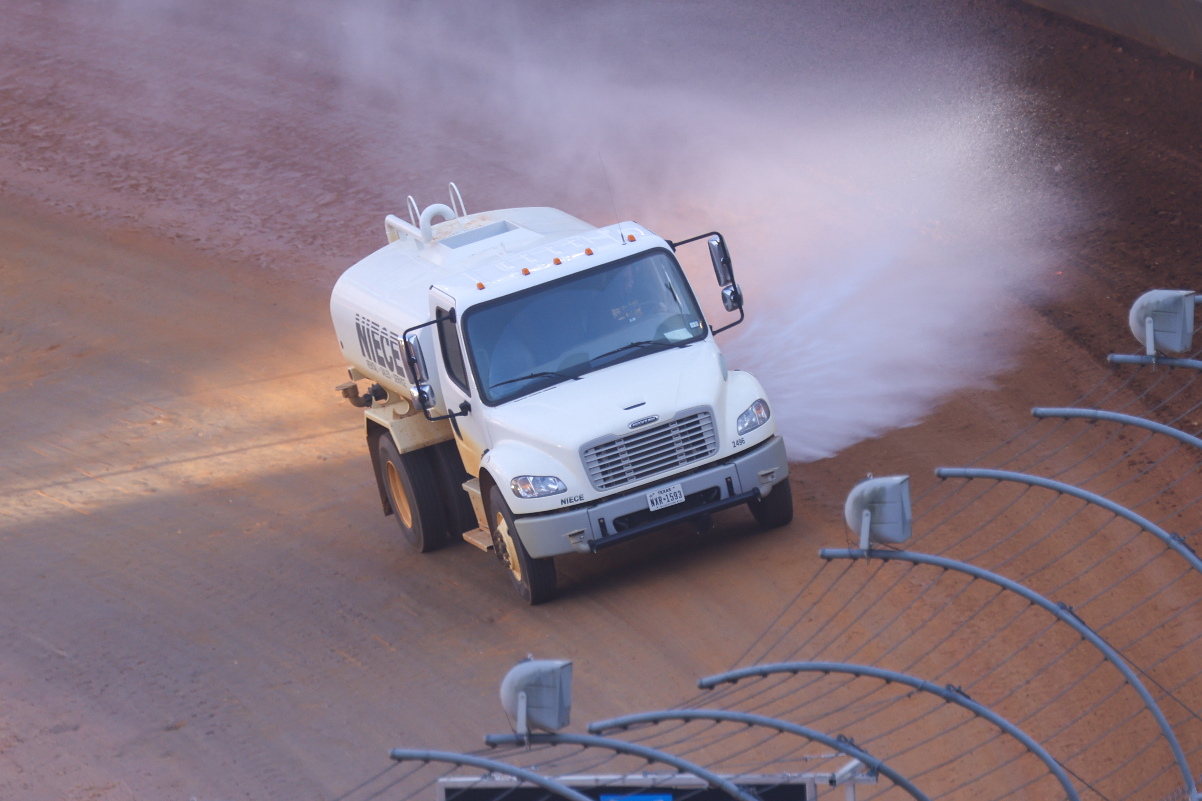 Mar 29, 2021; Bristol, TN, USA; A water truck sprays water on the track during the NASCAR Food City Dirt Race at Bristol Motor Speedway. Mandatory Credit: Randy Sartin-USA TODAY Sports
