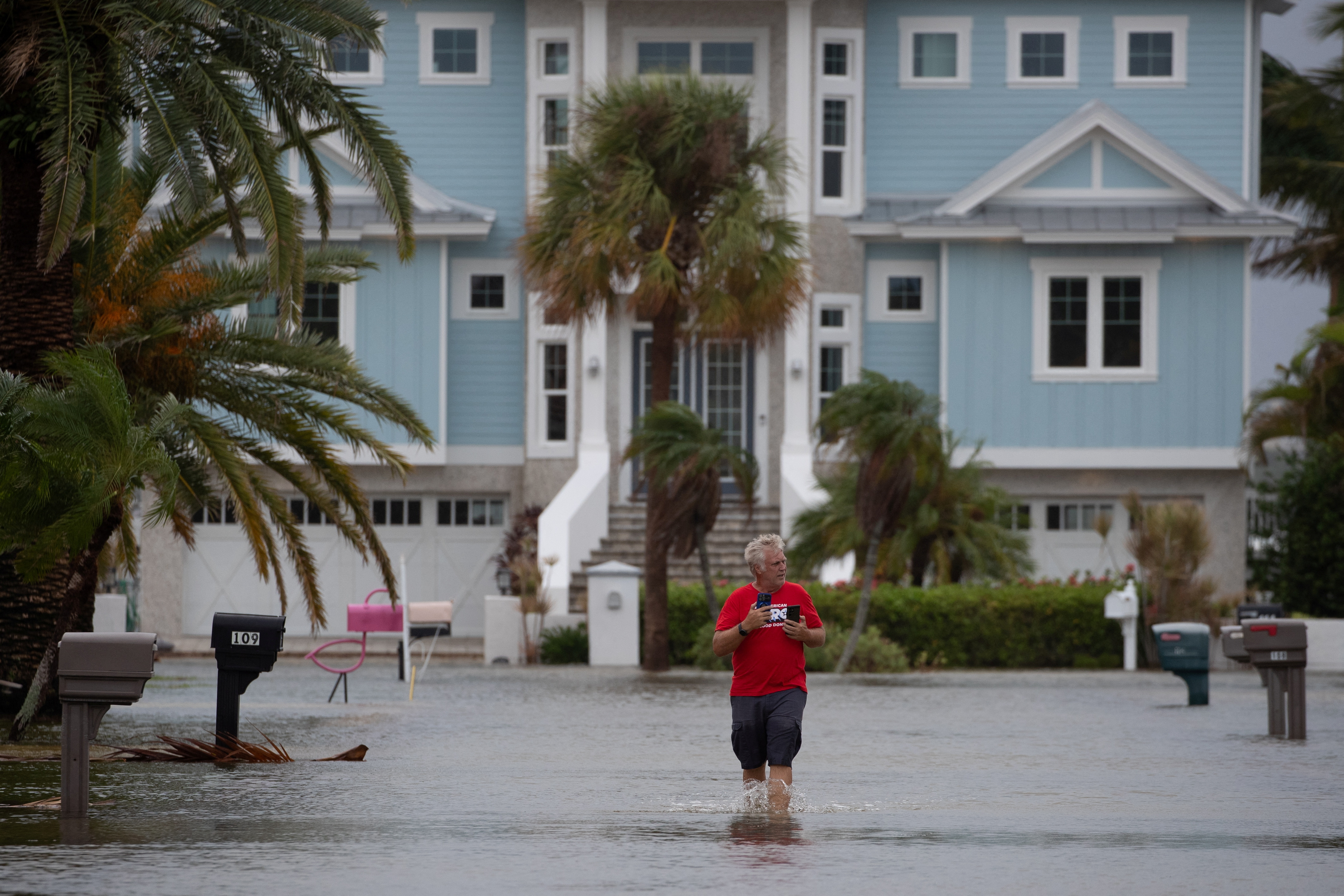 Resident surveys flood waters from Hurricane Idalia in Clearwater Beach, Floridia