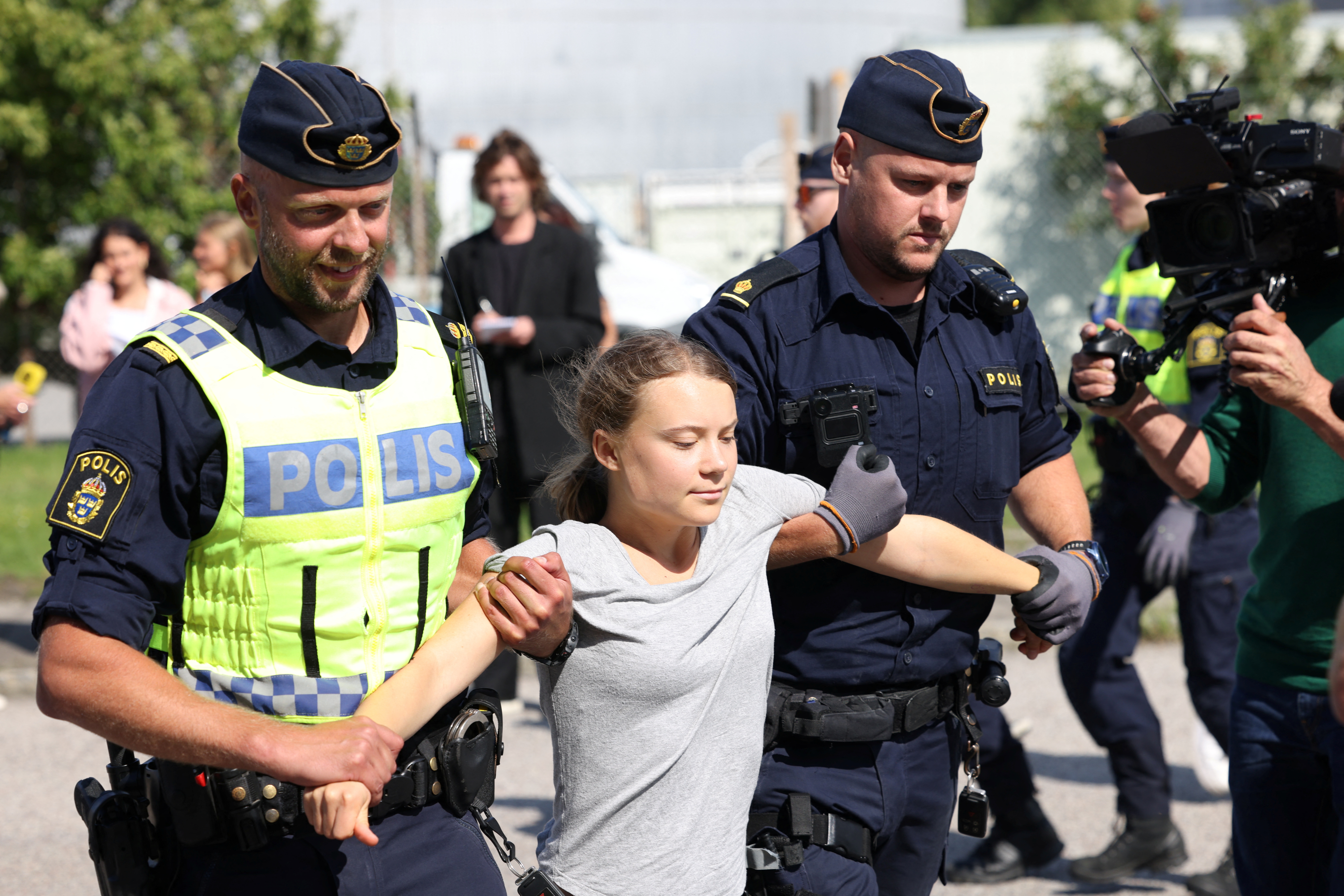 Greta Thunberg forcibly removed from protest hours after conviction for  similar action in June | Reuters