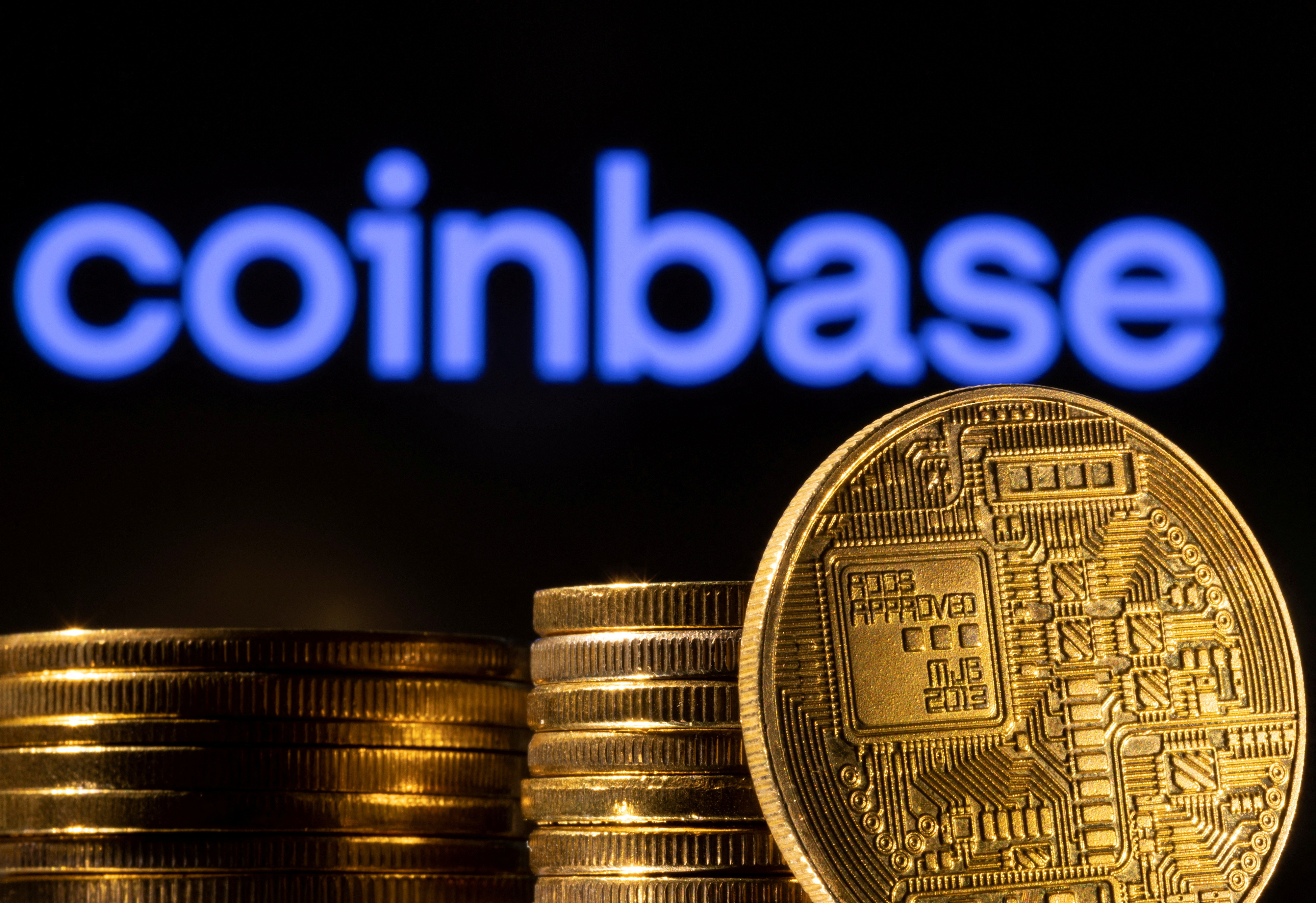 The illustration shows a representation of the cryptocurrency and the Coinbase logo
