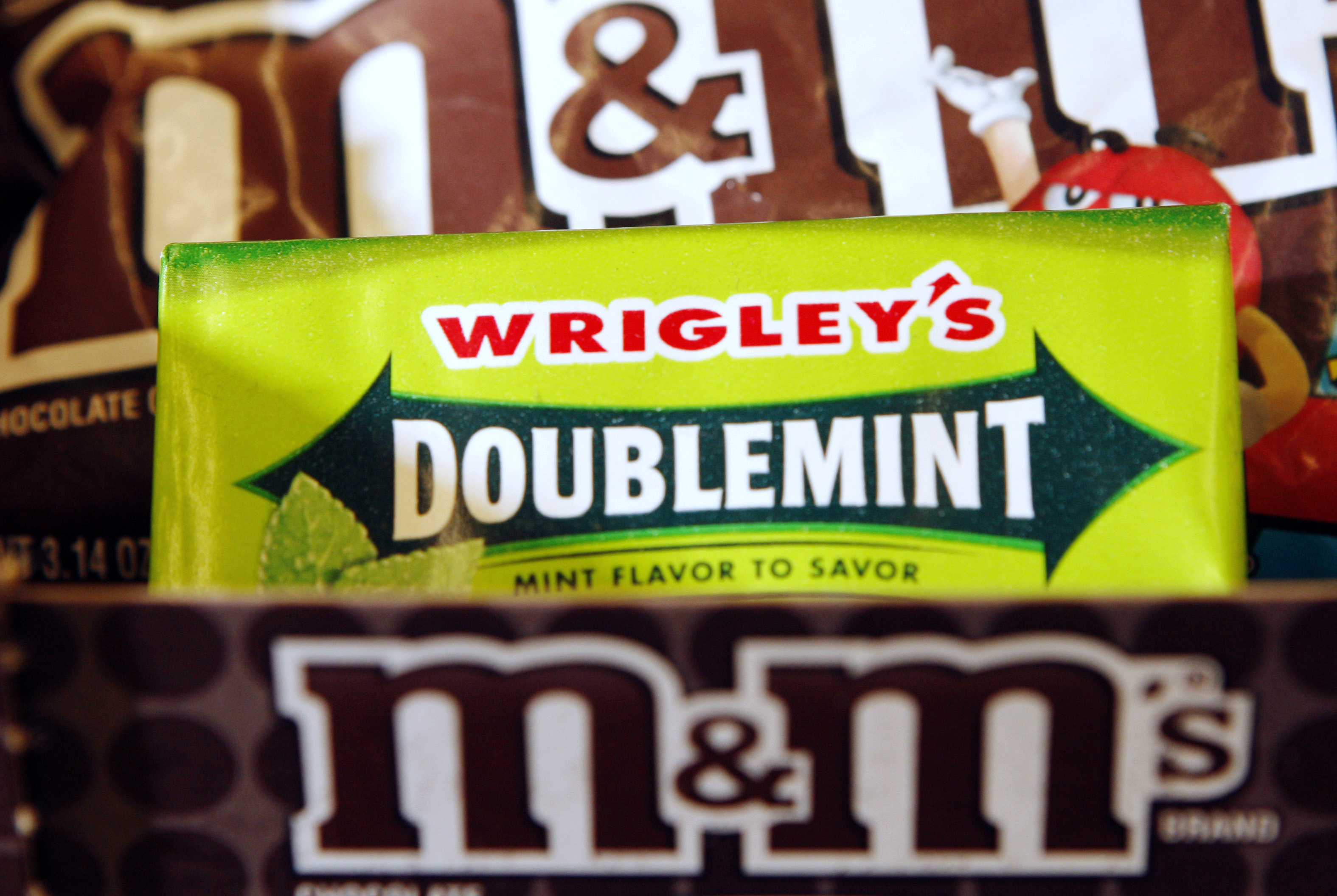 M&M's candies and pack of Wrigley's Doublemint gum in this photo illustration at a convenience store in Medford