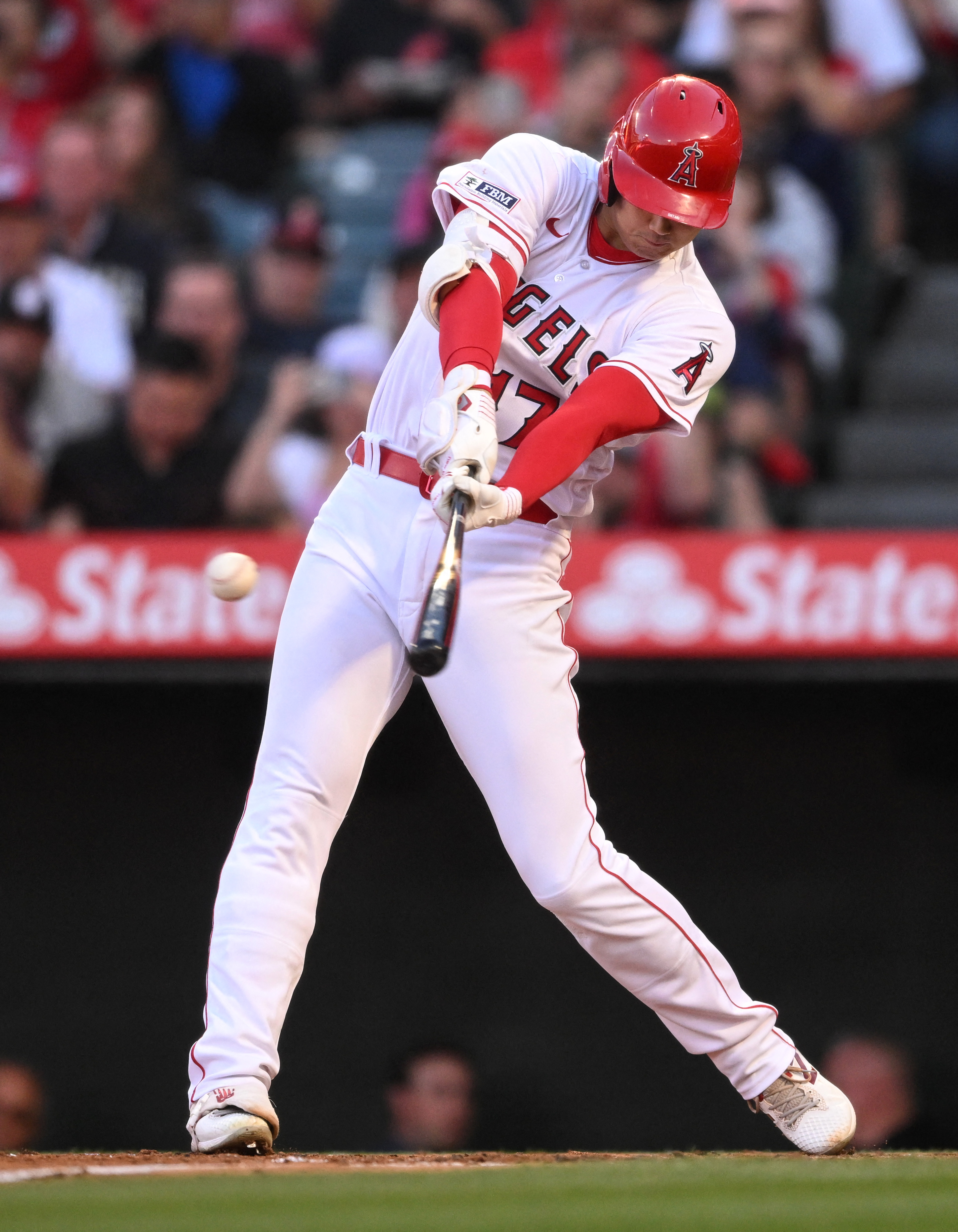 Shohei Ohtani of the Los Angeles Angels singles against the Chicago Cubs in  the second inning at Angel Stadium of Anaheim on Thursday, June 8, 2023, in  Anaheim, California., National Sports