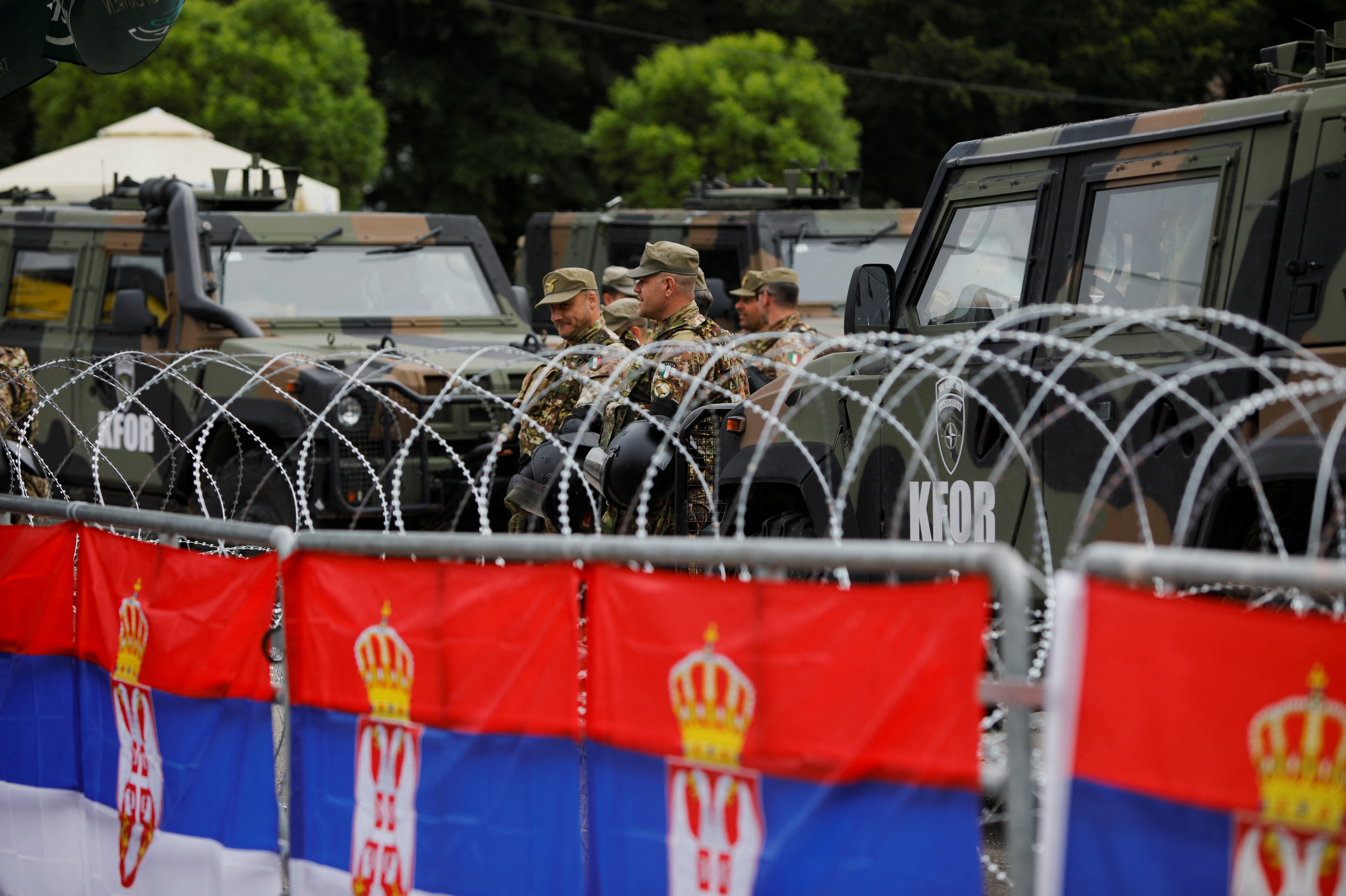 Members of the NATO-led Kosovo Force (KFOR) stand guard in Leposavic