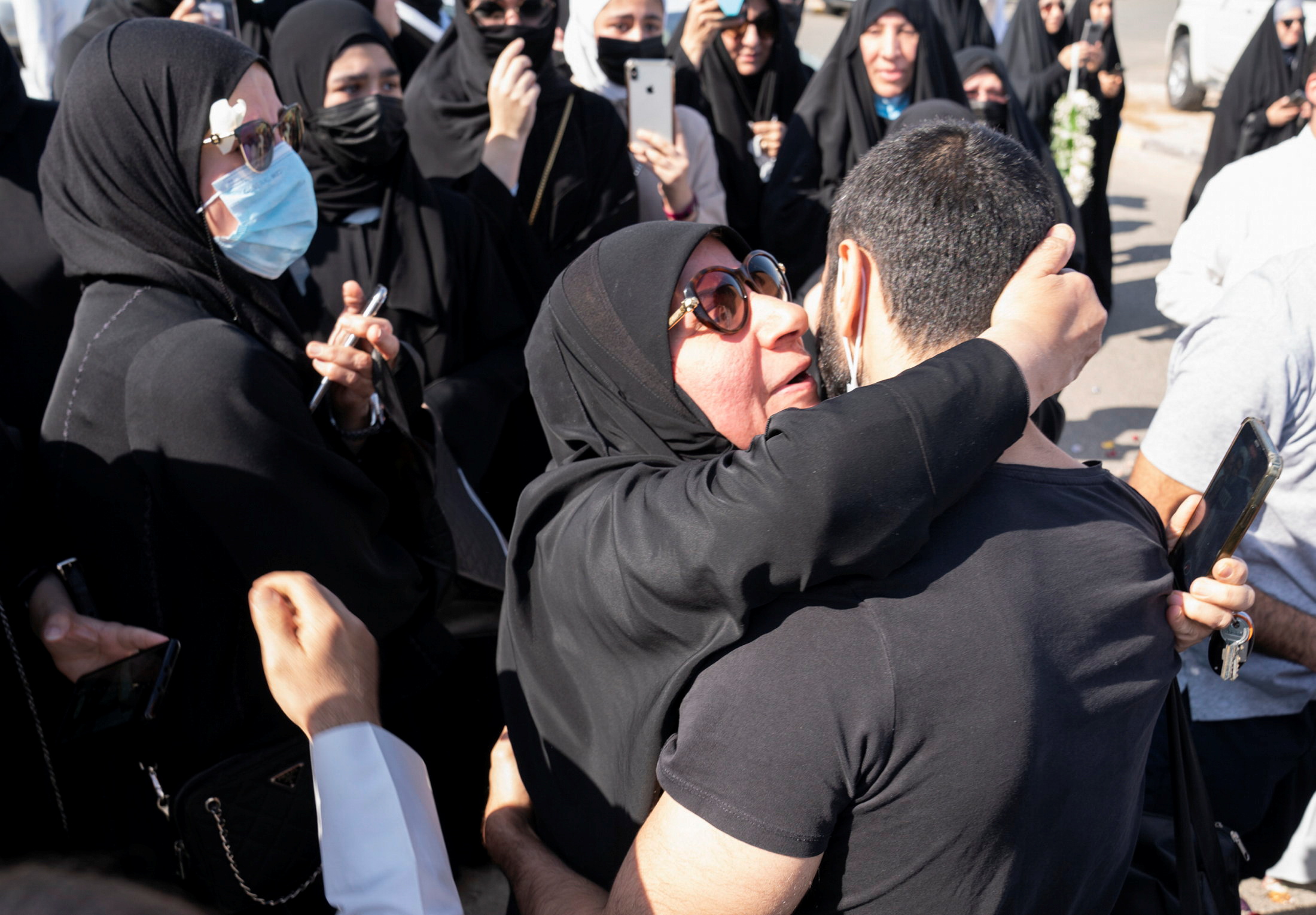 A Kuwaiti political prisoner, is kissed by his mother after he was released in Kuwait, November 14, 2021. REUTERS/Stephanie McGehee