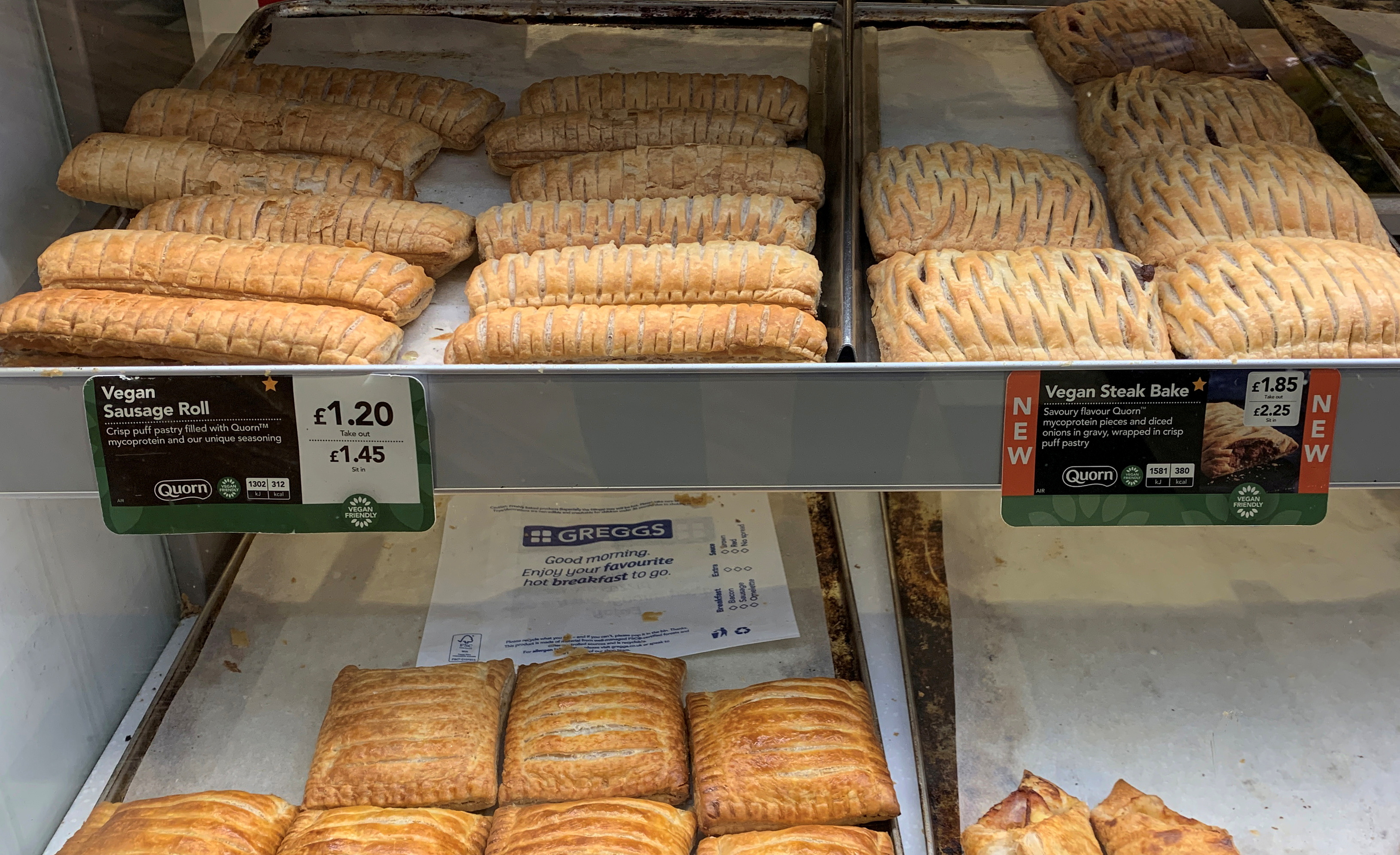 Vegan sausage rolls and Steak Bakes are seen for sale in a Greggs bakery near Manchester