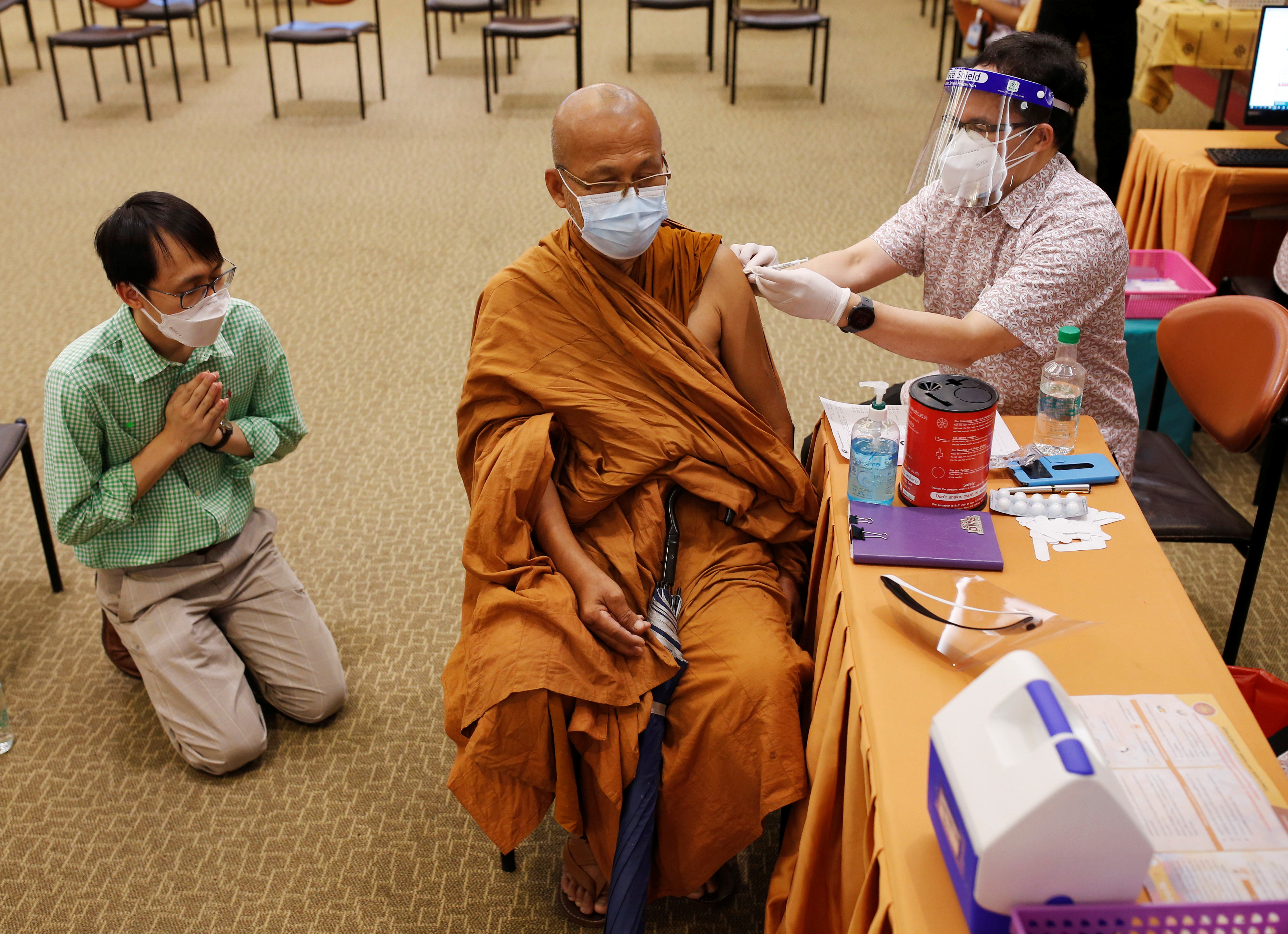 A Buddhist monk receives coronavirus disease (COVID-19) vaccination at a hospital in Bangkok