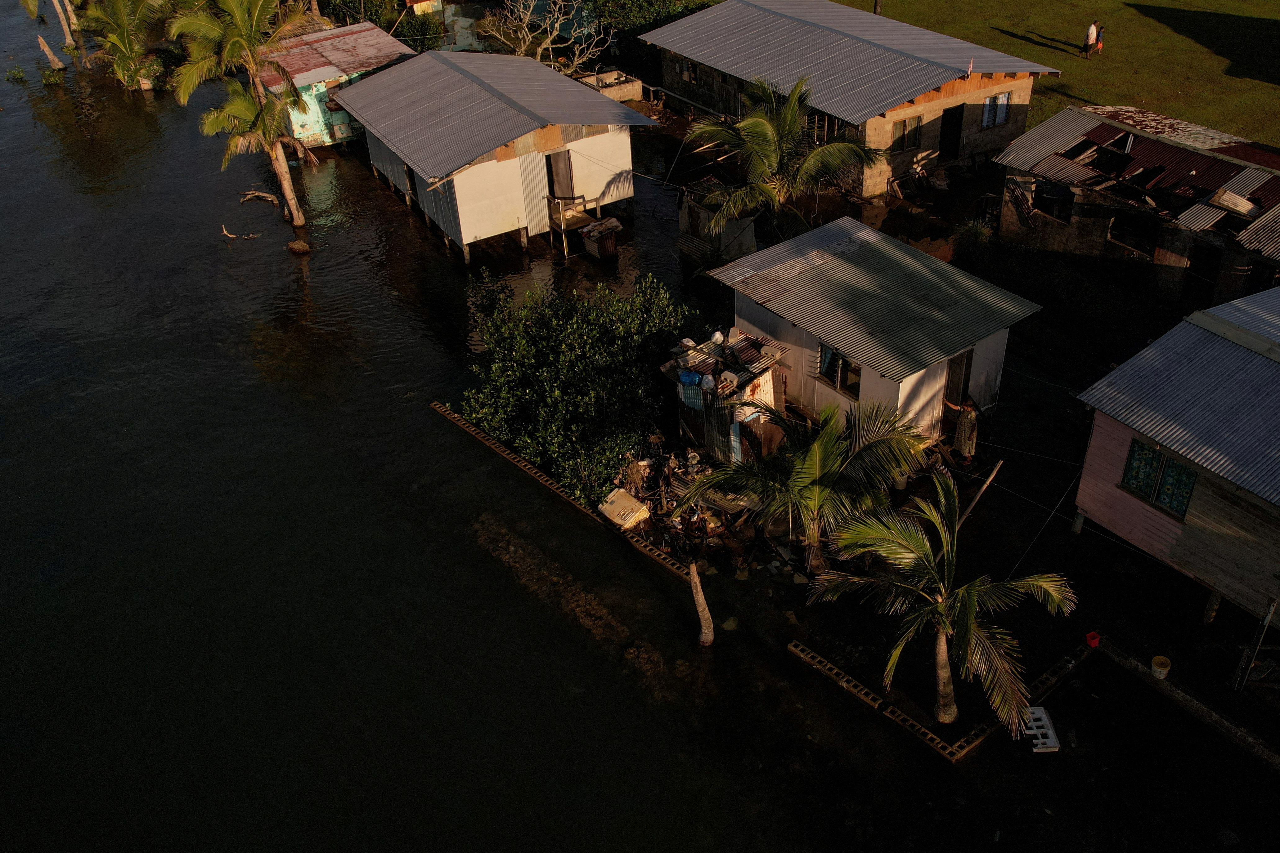 The Wider Image: Rising sea levels are forcing Fiji's villagers to relocate. They want polluters to pay instead