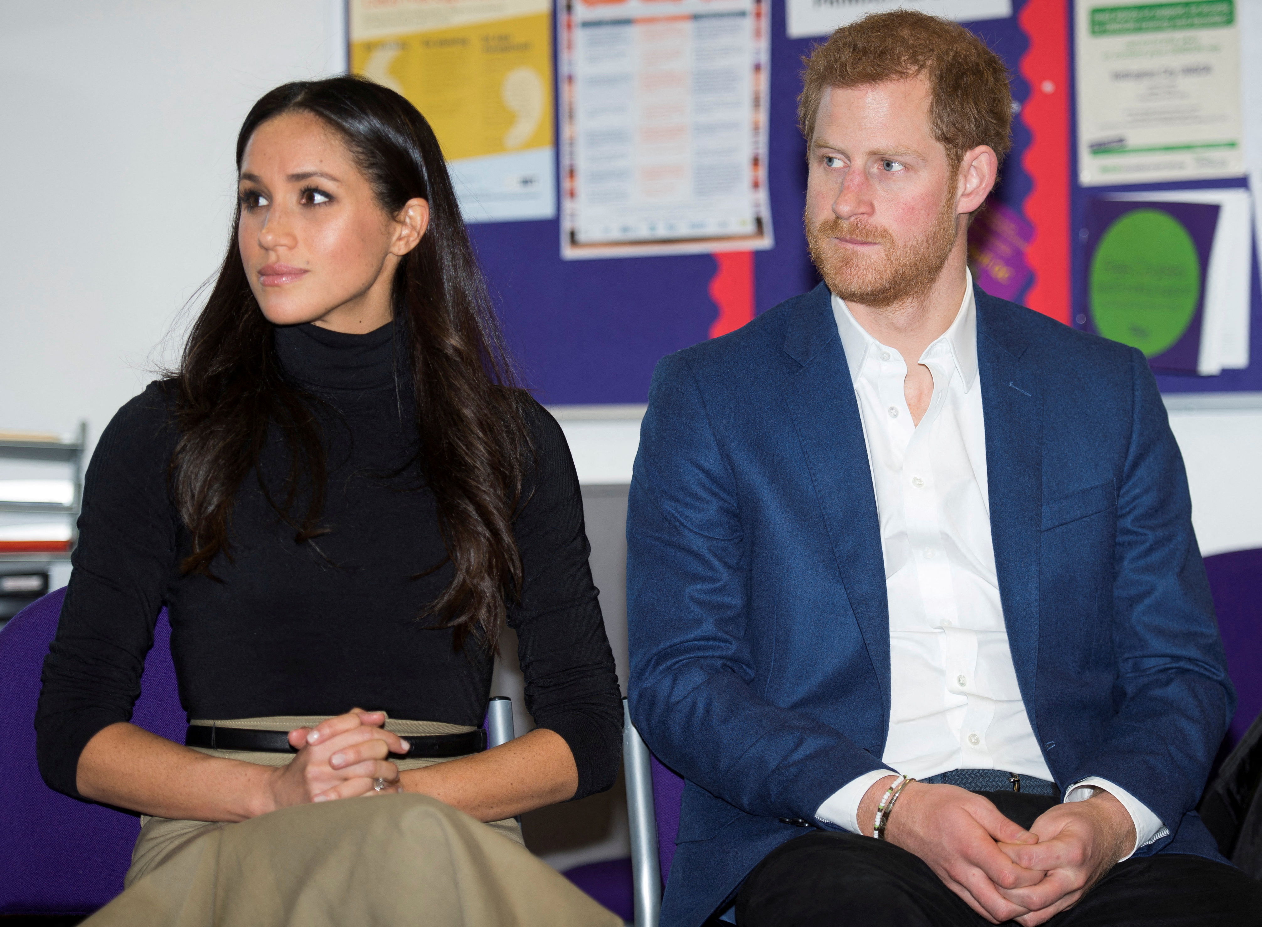 lFILE PHOTO: Britain's Prince Harry and his fiancee Megan Markle visit Nottingham Academy in Nottingham