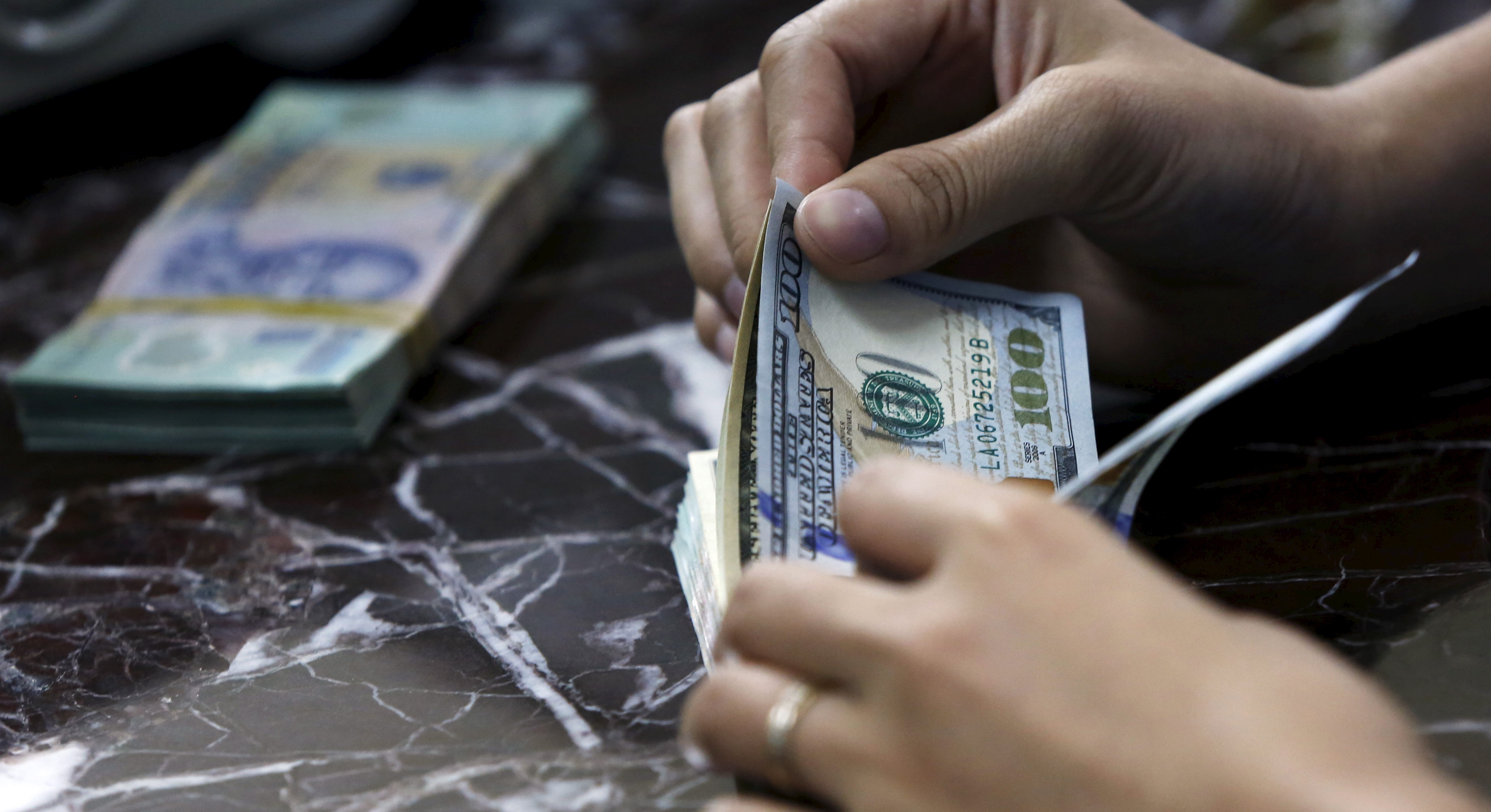 vietnam-c-bank-buys-dollars-to-shore-up-reserves-after-selloff-reuters