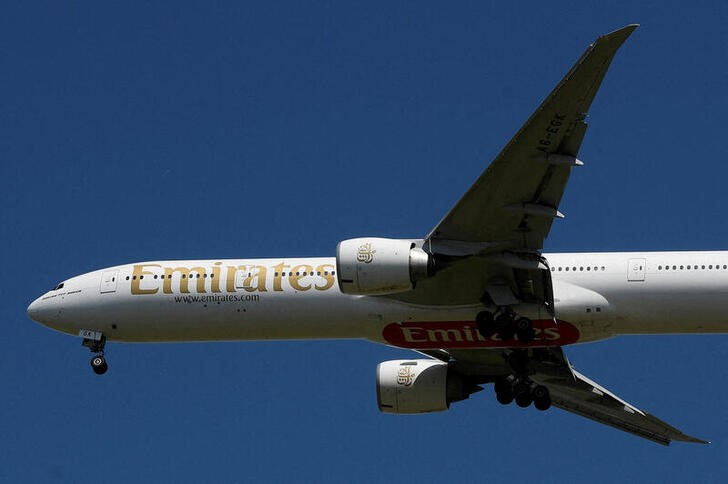 An Emirates passenger plane comes in to land at London Heathrow airport, Britain