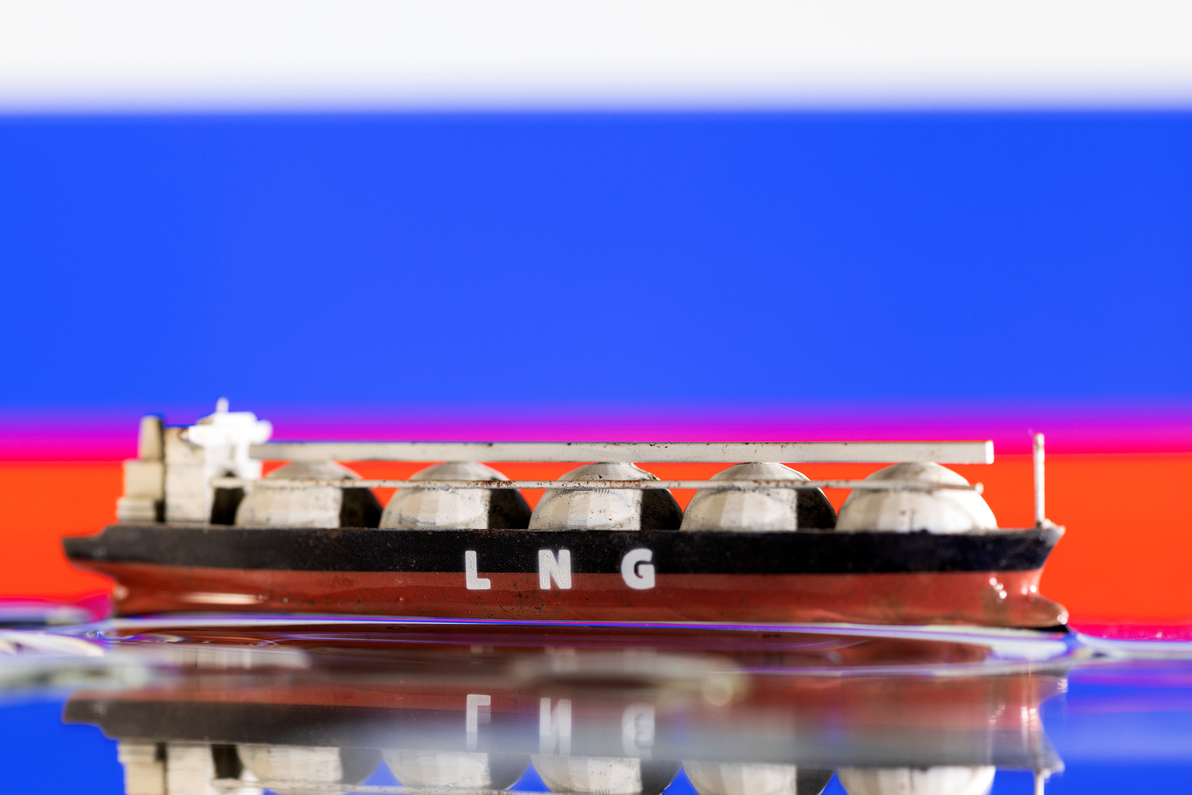 Illustration shows model of LNG tanker and Russia's flag