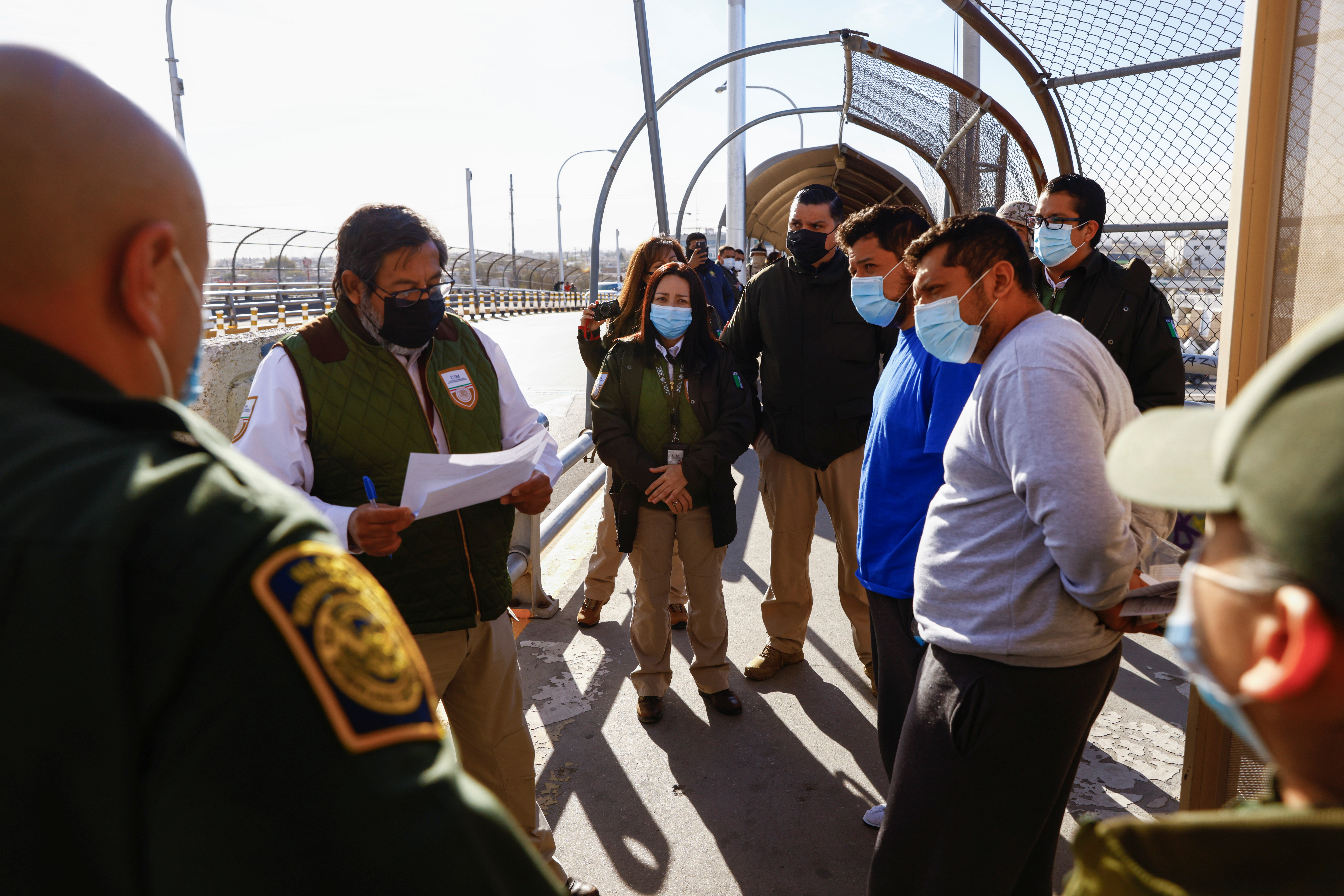 Migrants under the Migrant Protection Protocols (MPP) program are delivered by agents of the U.S Border Patrol to agents of the National Migration Institute of Mexico at the Lerdo-Stanton International Bridge in El Paso