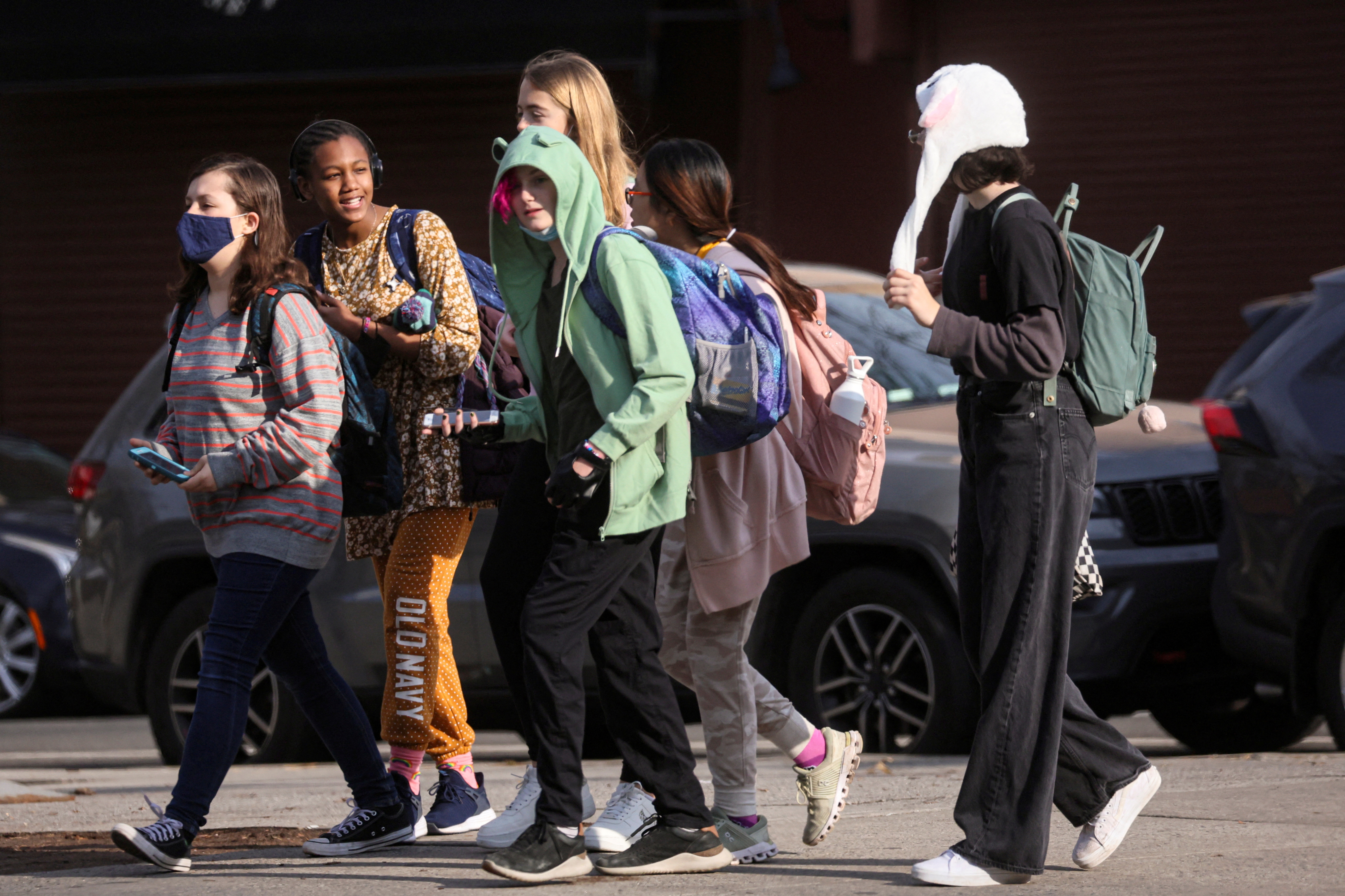 Children are seen walking to school in Brooklyn, New York City