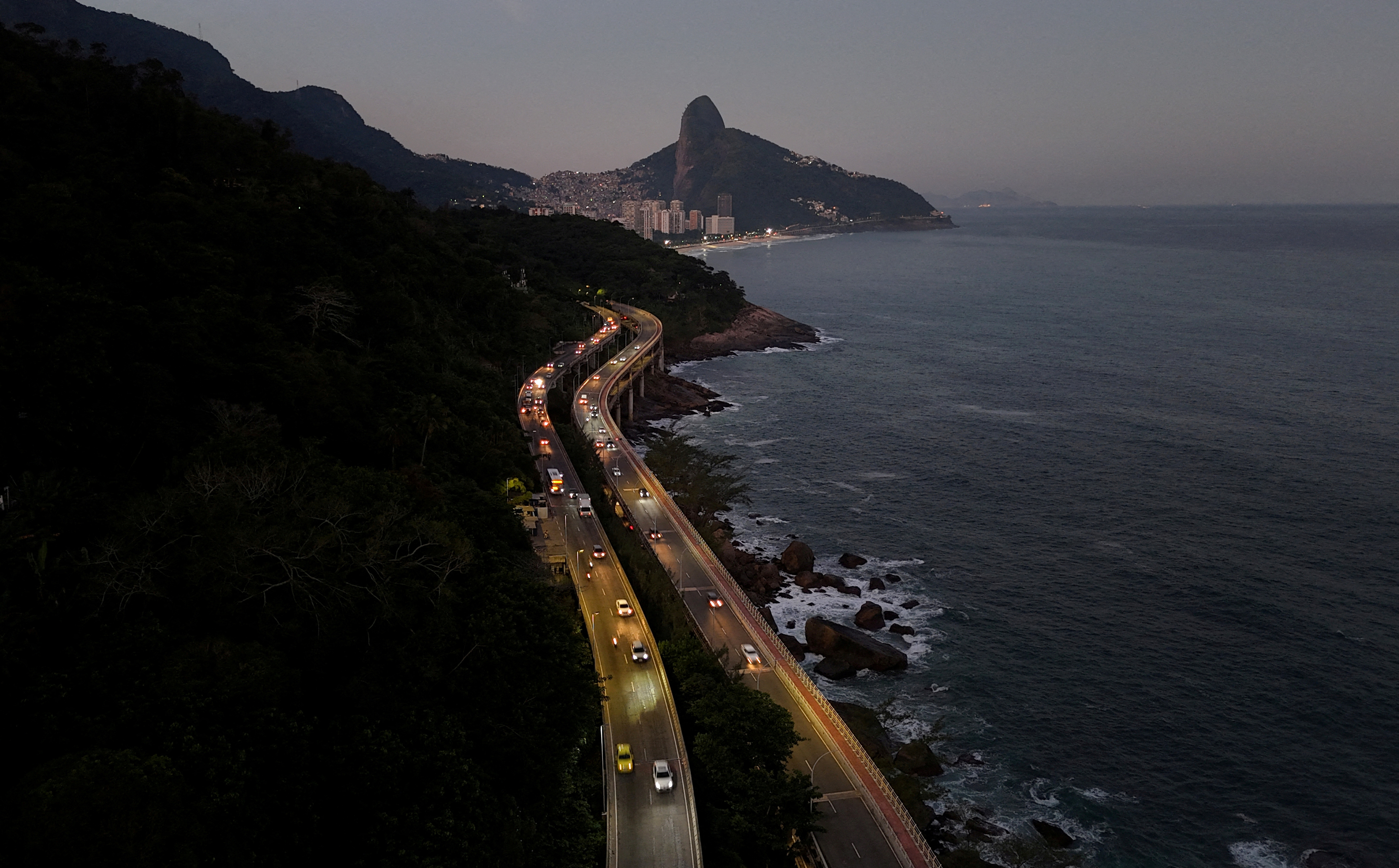 A drone view shows a road with the Dois Irmaos (Two brothers) peaks in the background Rio de Janeiro