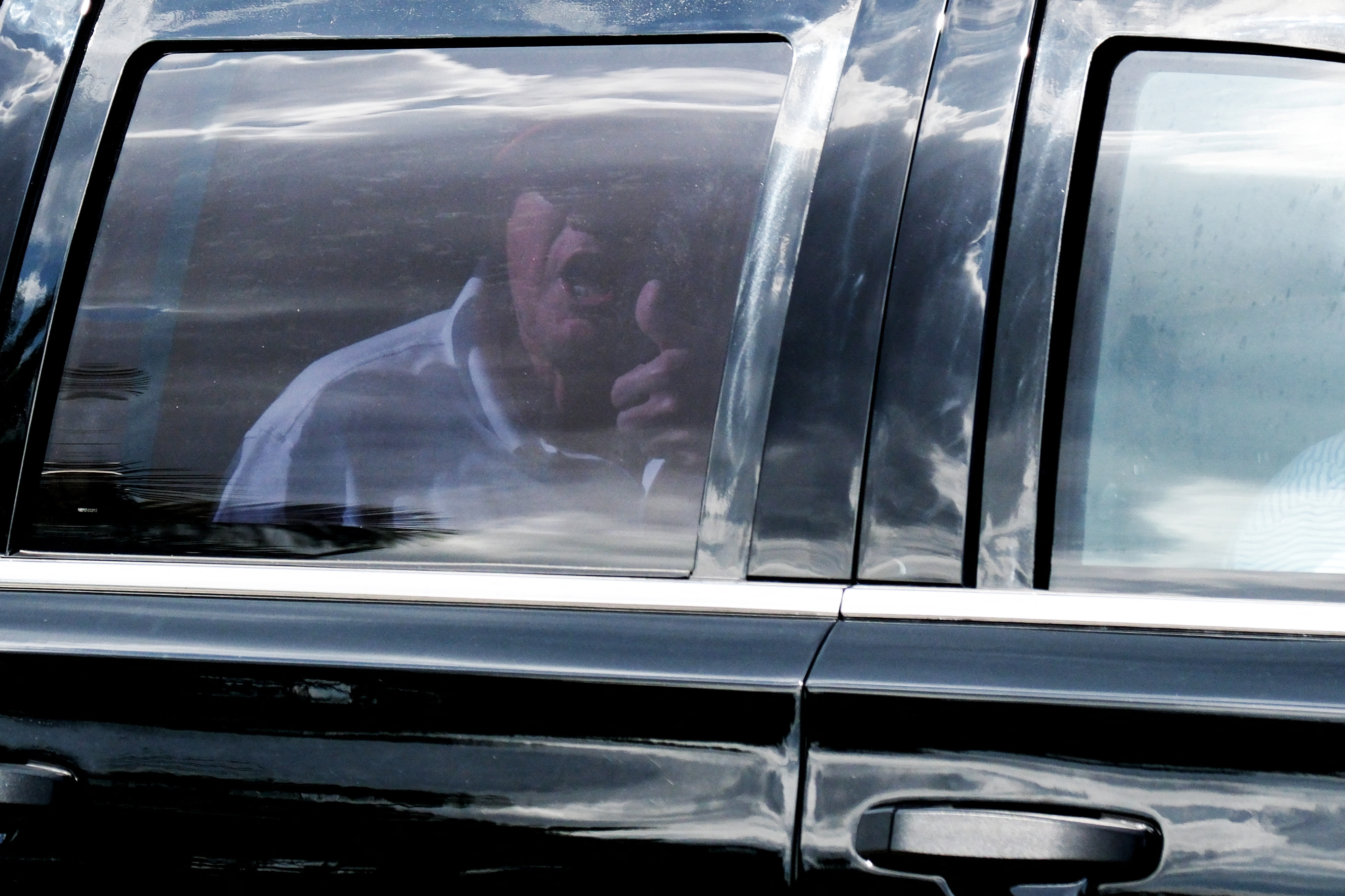 Former U.S. President Donald Trump in a motorcade leaves his Trump International Golf Club after his indictment by a Manhattan grand jury