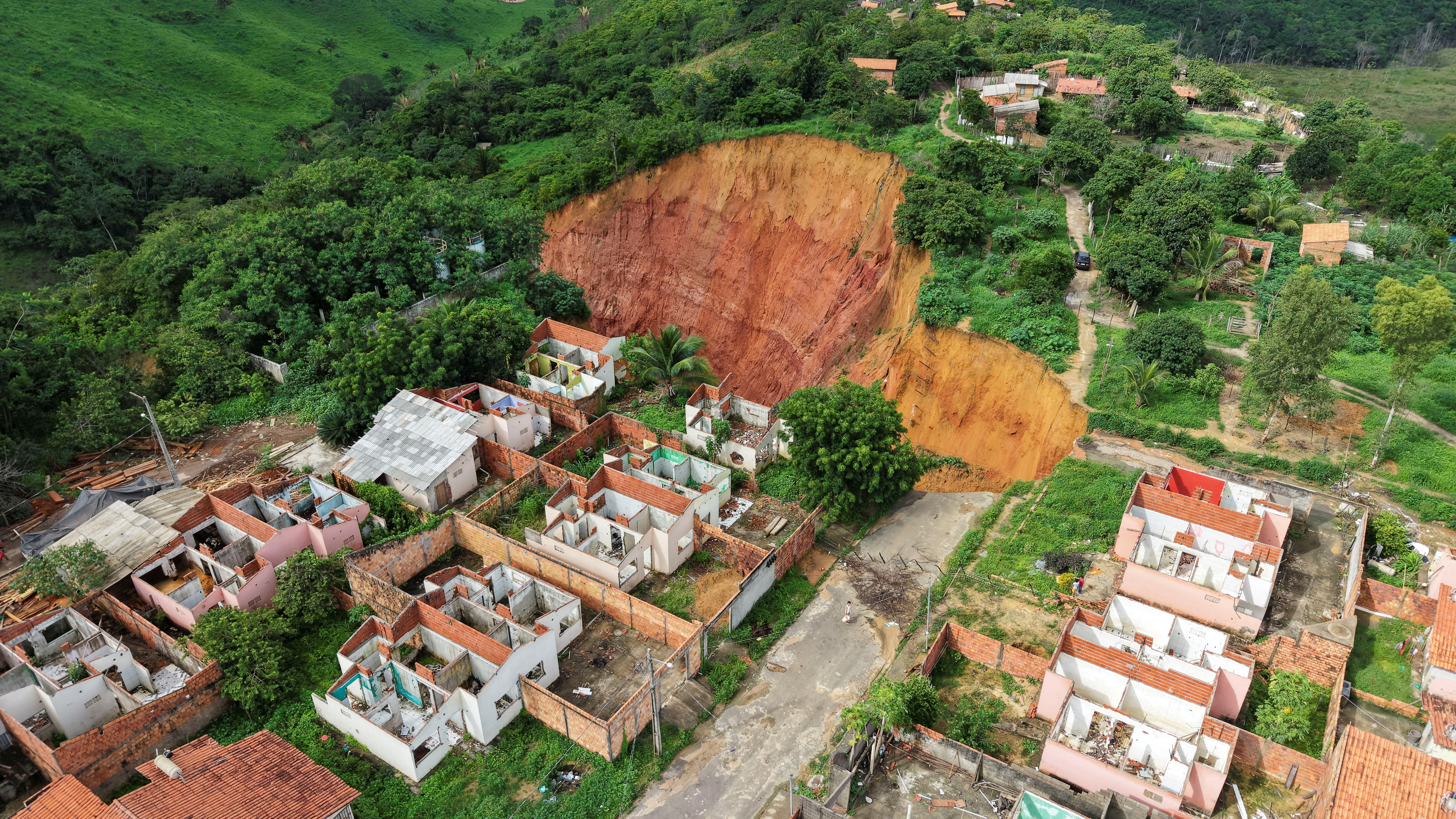 Massive sinkholes put hundreds in Amazonian town at risk | Reuters