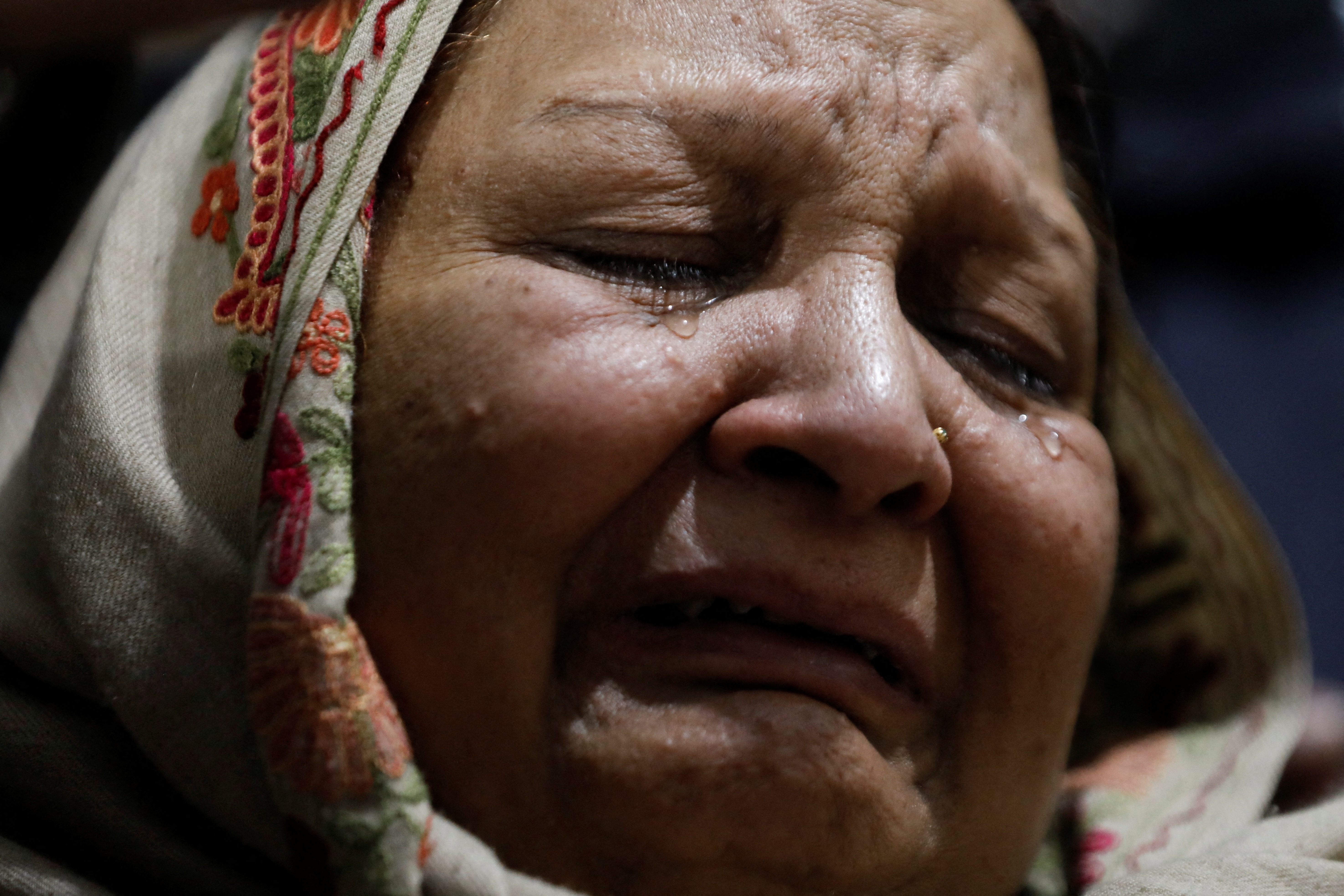 Woman mourns the death of priest William Siraj, who was killed by unknown armed men in Peshawar