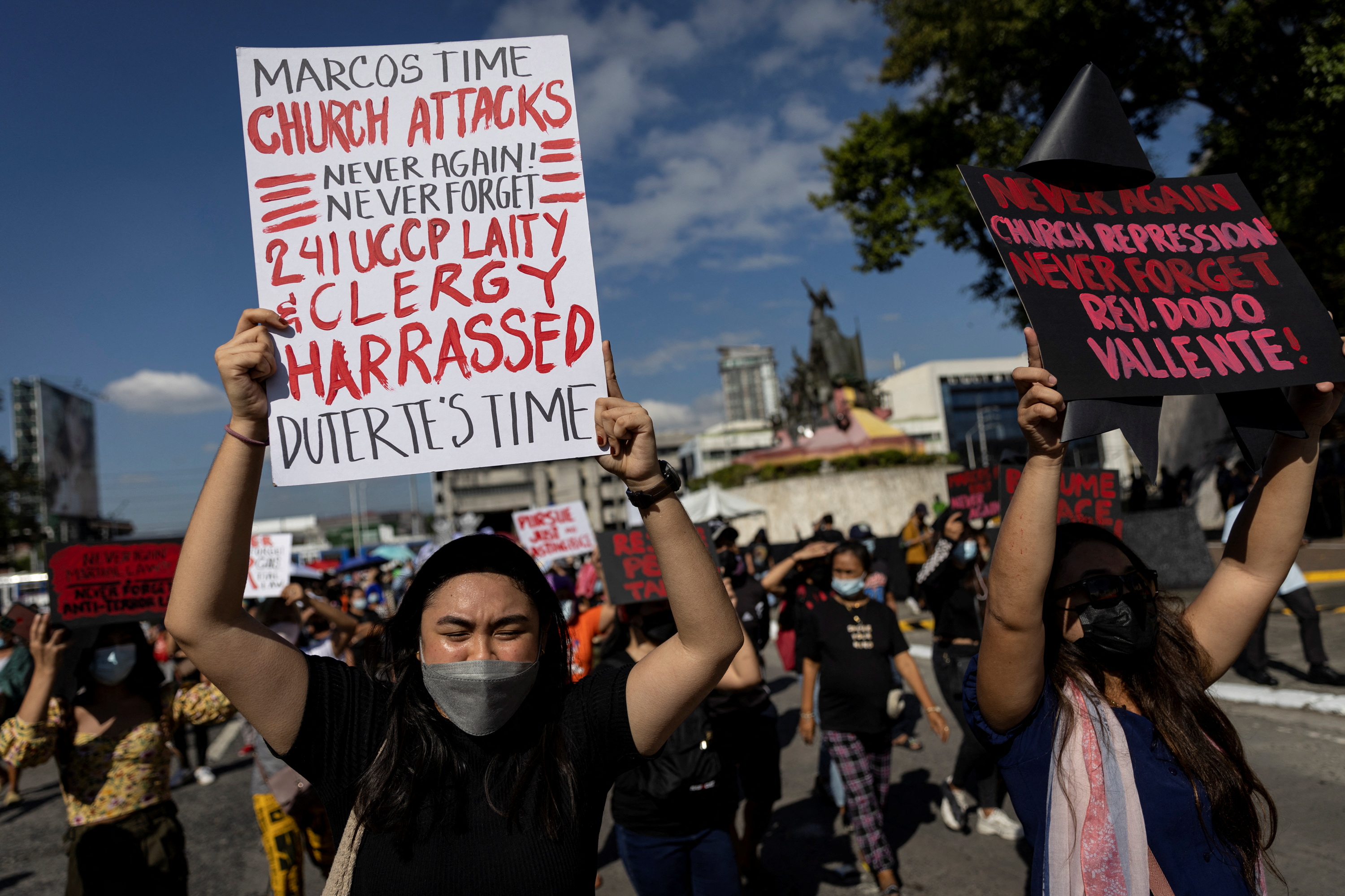 Philippines marks Marcos overthrow as son homes in on presidency | Reuters