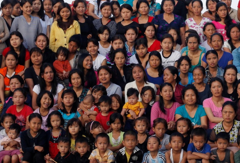 Family members of Ziona pose for a group photograph in Baktawng village in the northeastern Indian state of Mizoram, October 7, 2011. REUTERS/Adnan Abidi 