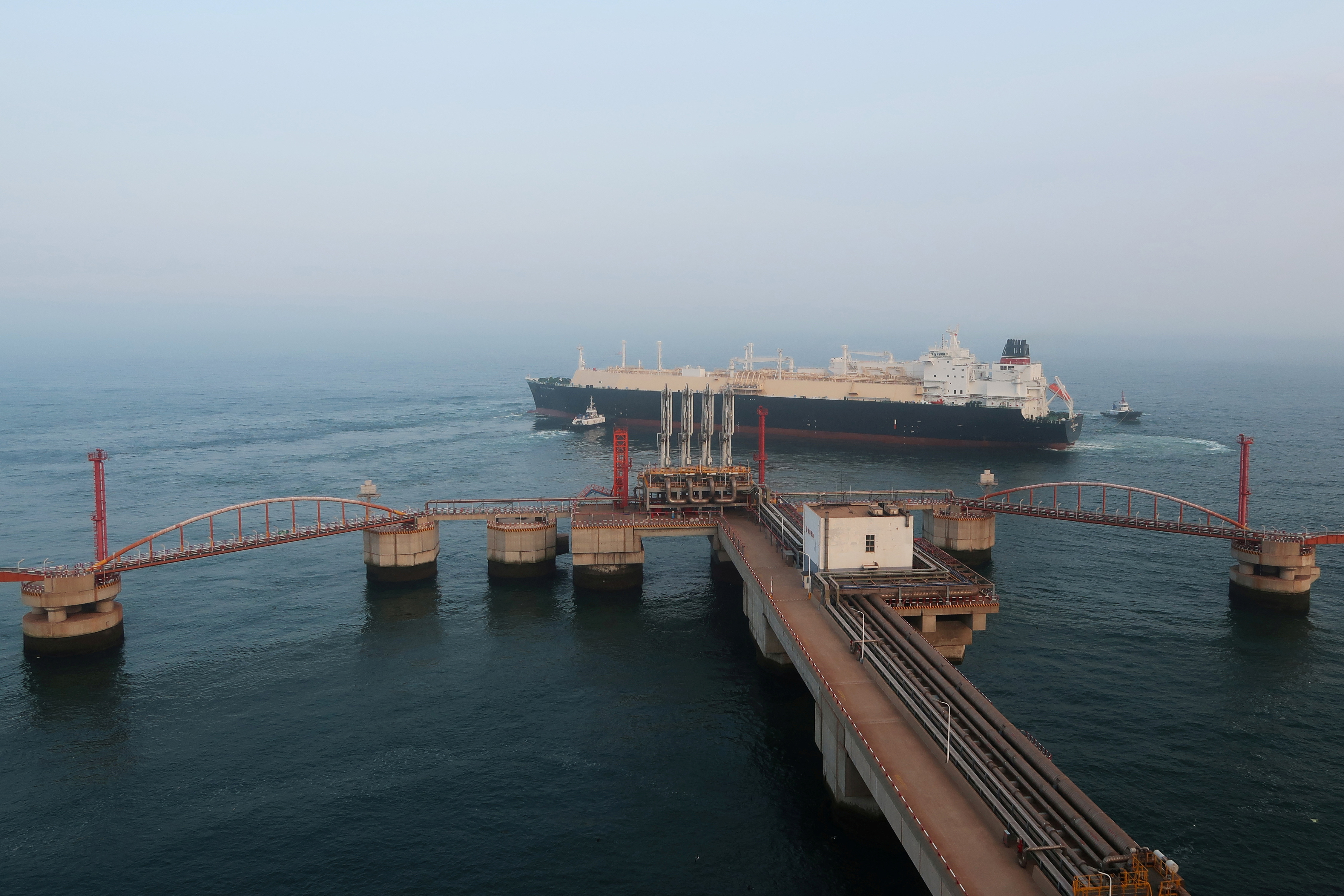 A liquified natural gas (LNG) tanker leaves the dock after discharge at PetroChina's receiving terminal in Dalian