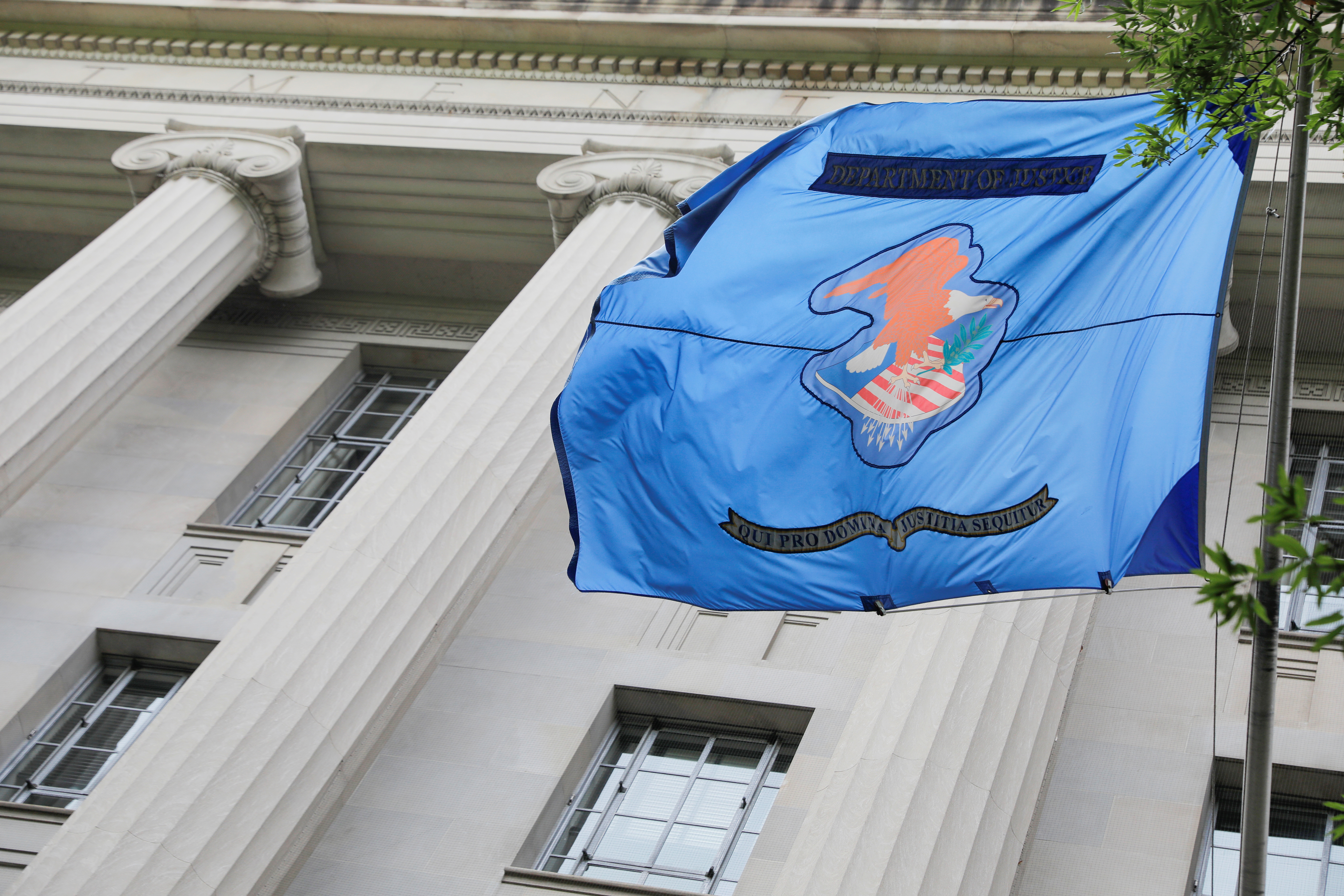 The flag and crest of the United States Department of Justice (DOJ) is seen at their headquarters in Washington, D.C.