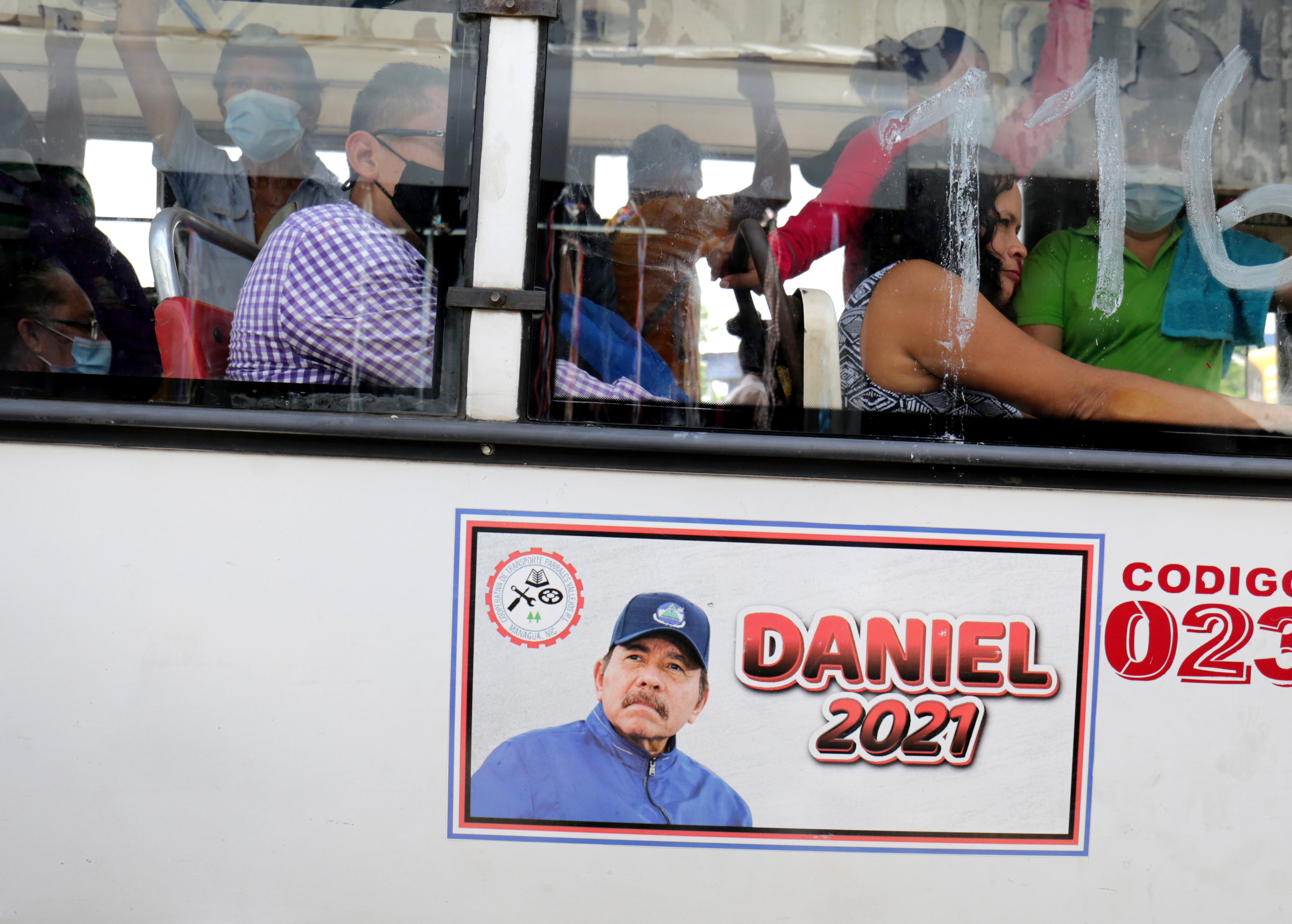 A poster promoting Nicaragua President Ortega as a presidential candidate is displayed on a public bus ahead of the country's presidential elections in November