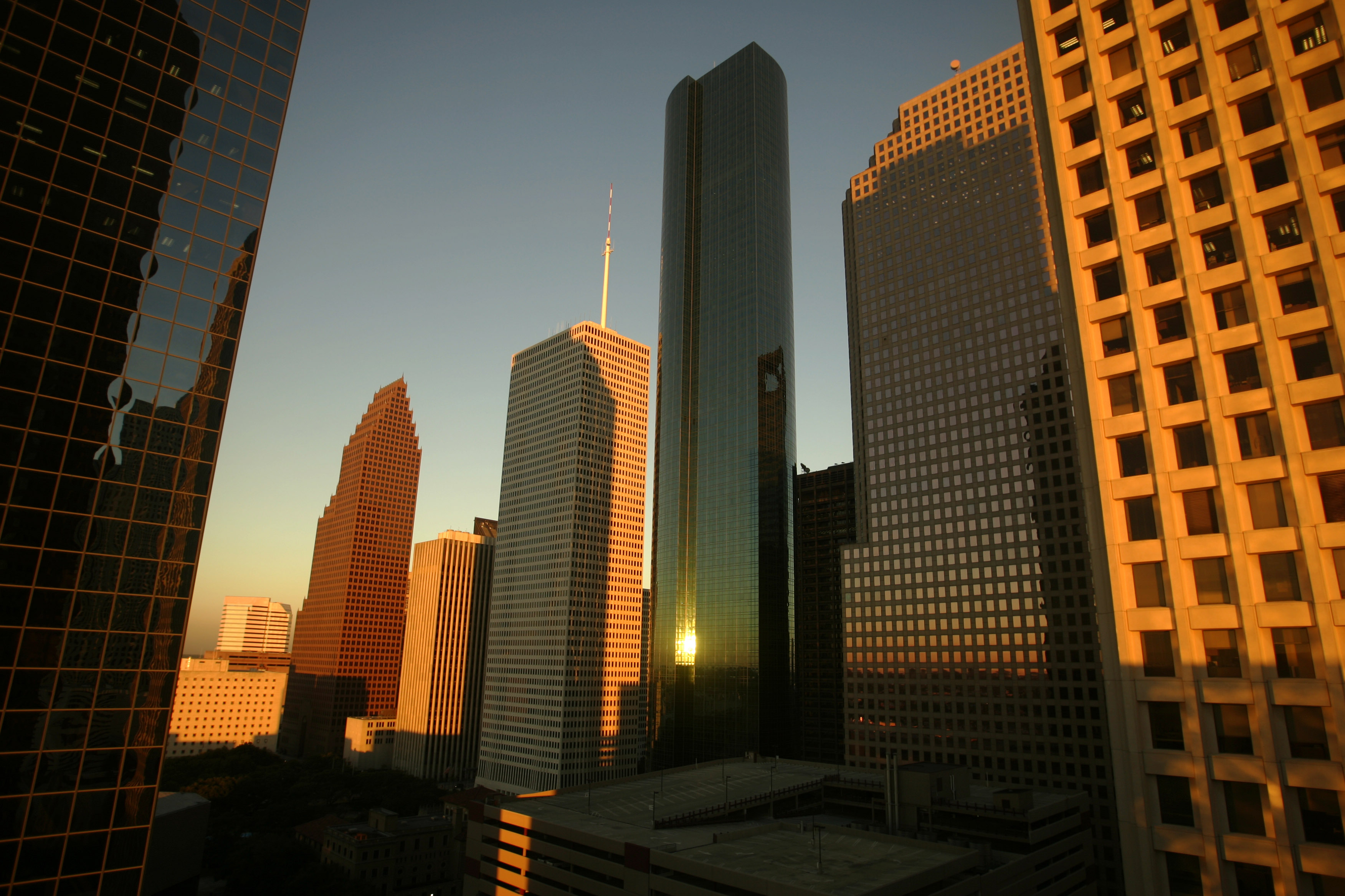 Sun reflects off downtown buildings in Houston.